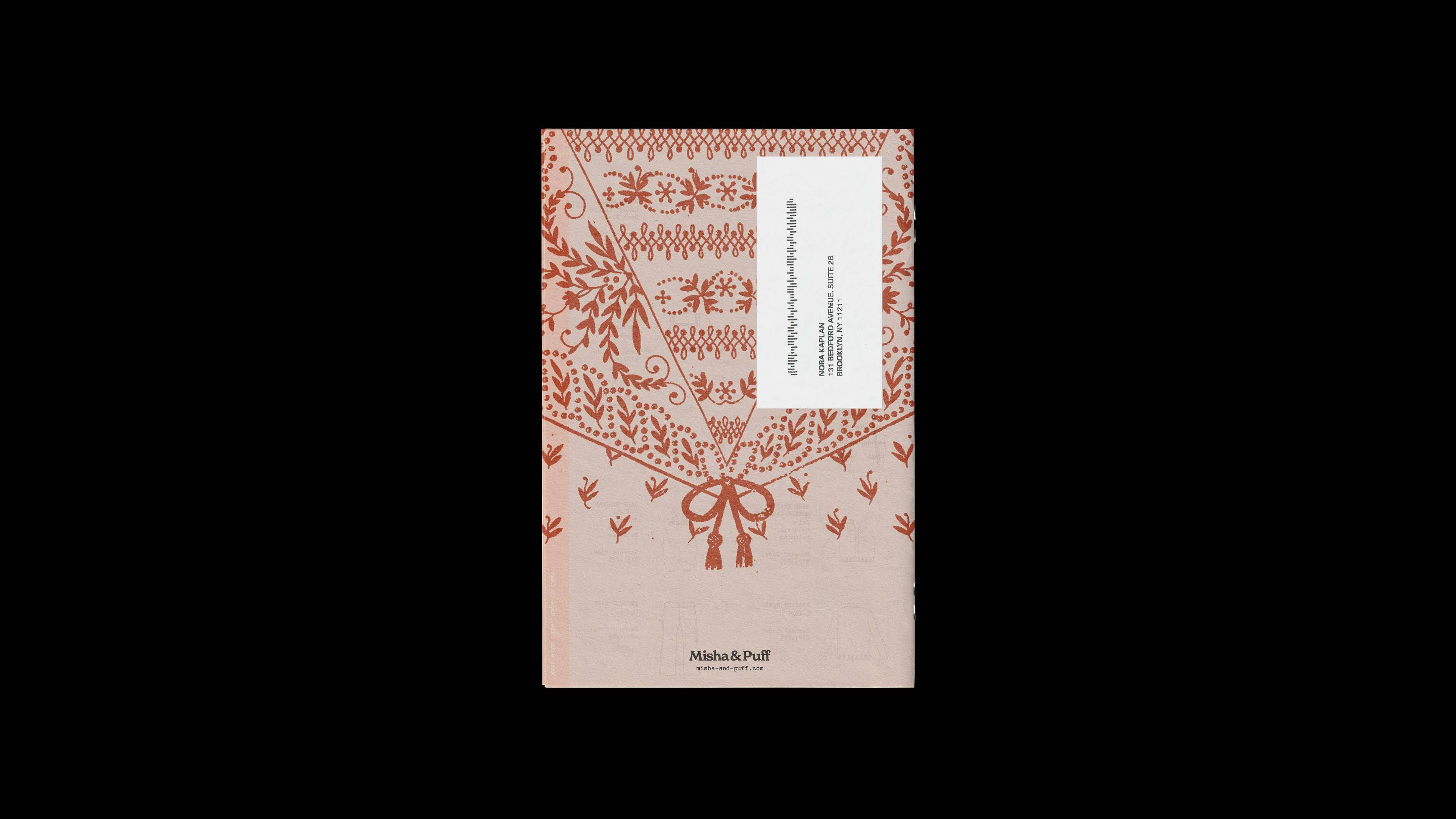 Misha & Puff catalog back cover: terracotta embroidery-pattern print on blush paper with a mailing label affixed.