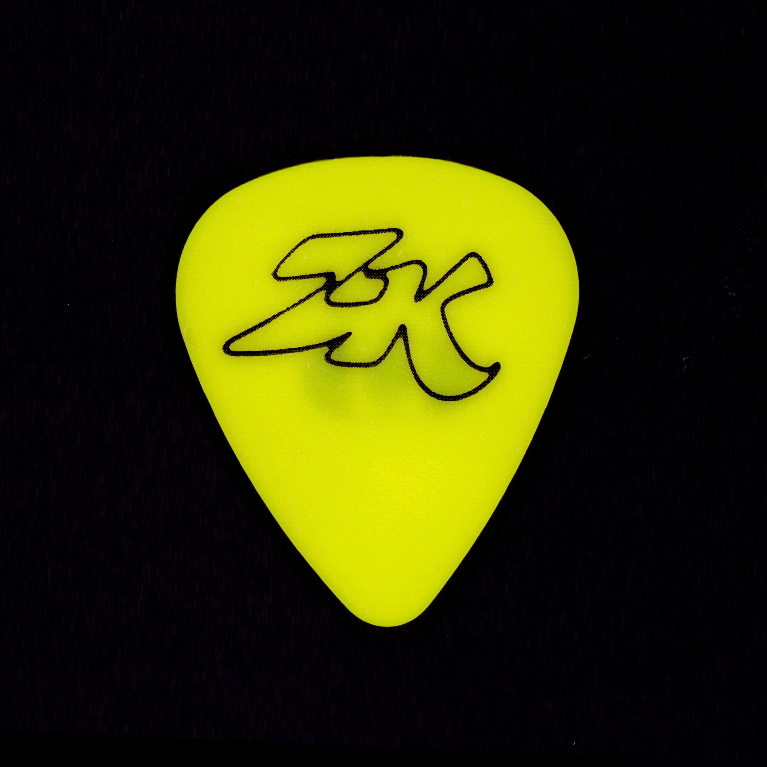 WYFSTW "Ziggy Katz" neon green guitar pick with "ZK" monogram logo, black bg, included in record