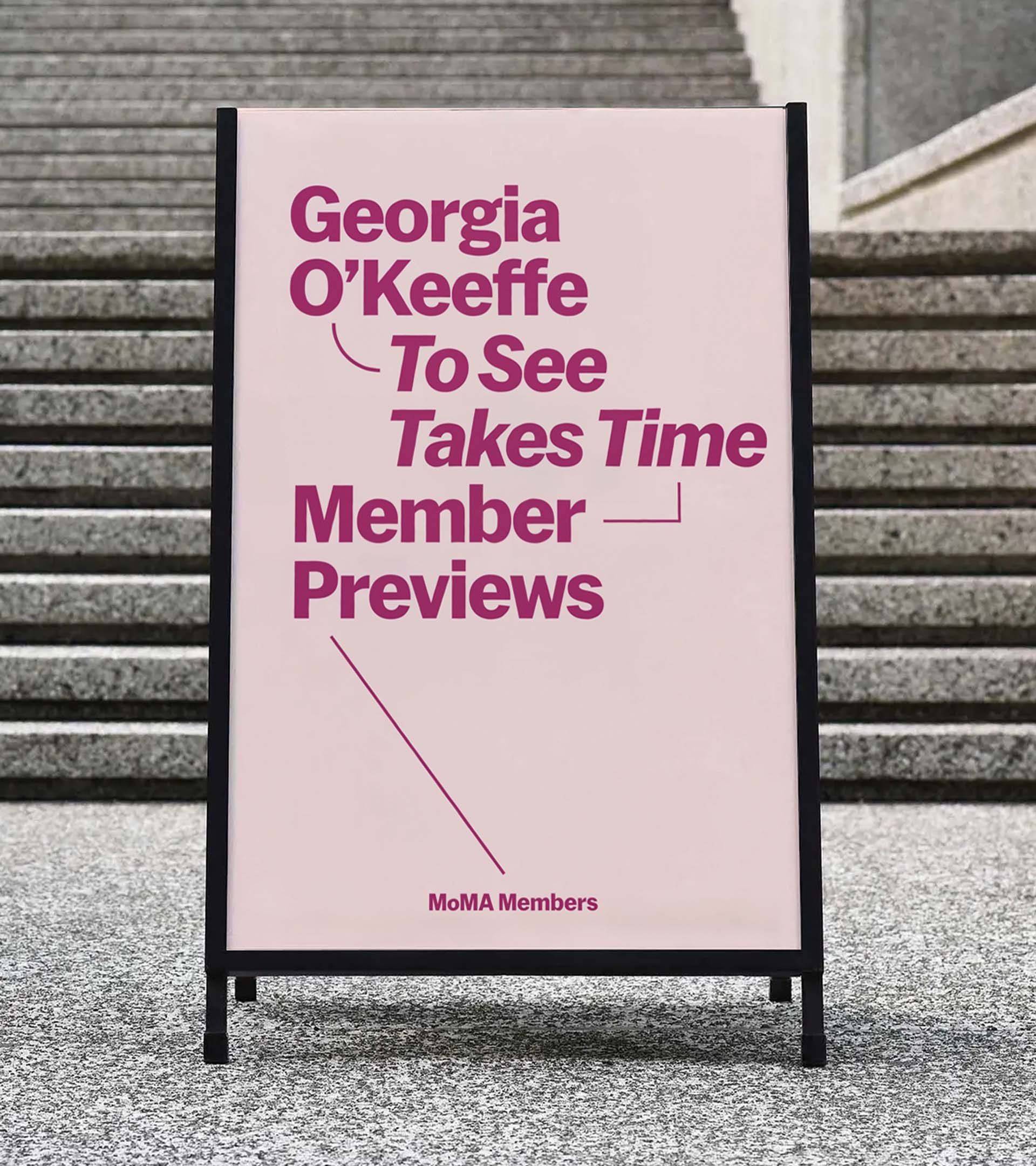 A-frame sidewalk sign: 'Georgia O'Keeffe: To See Takes Time / Member Previews' connected by lines in magenta on blush paper 
