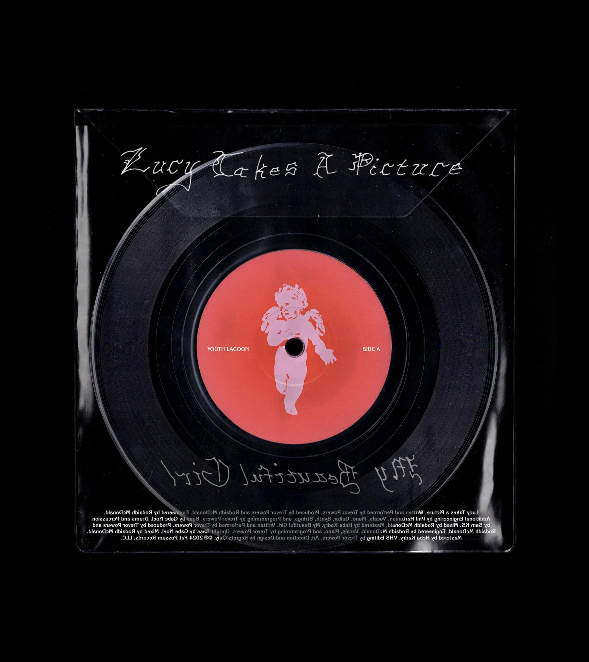 Youth Lagoon "Lucy Takes a Picture" 7-inch vinyl, Side A. Red label with cherub illustration in clear poly sleeve.