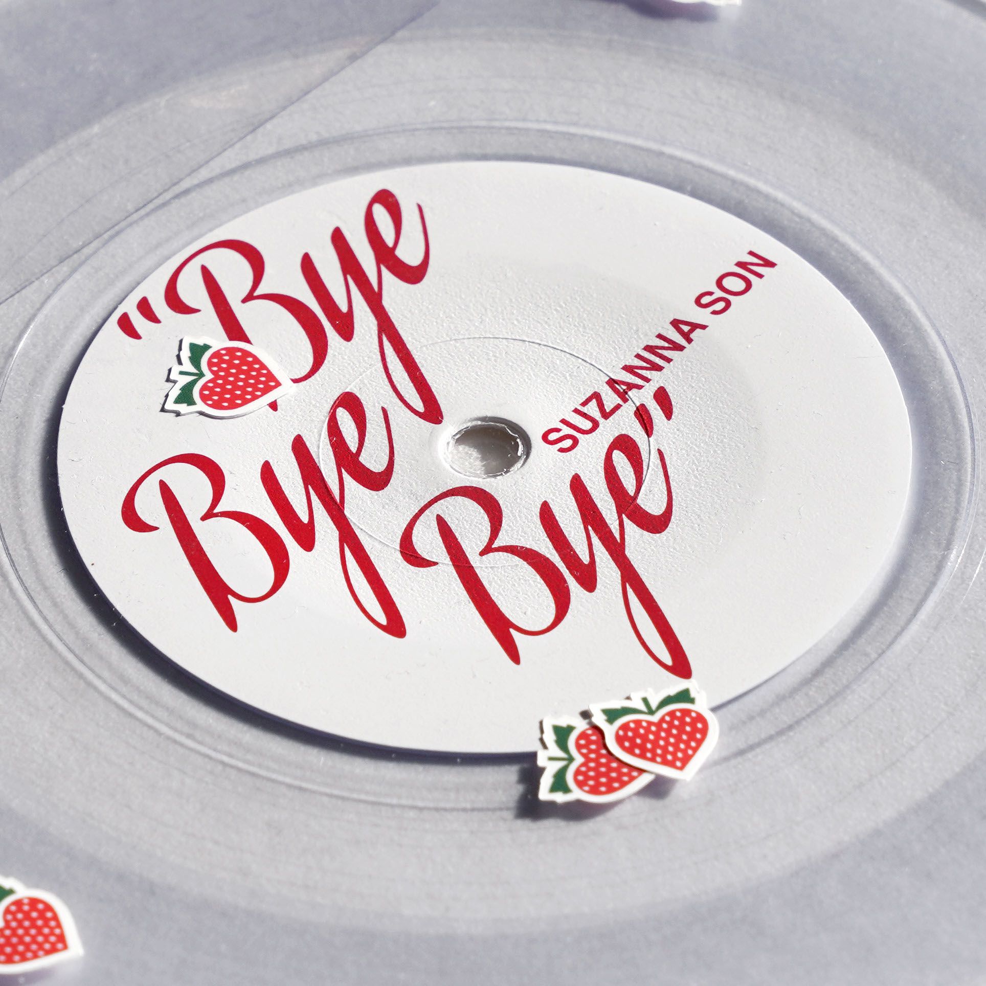 Red Rocket "Bye Bye Bye" / Suzanna Son clear vinyl 7": white label, Sean Baker red script, loose strawberry heart stickers