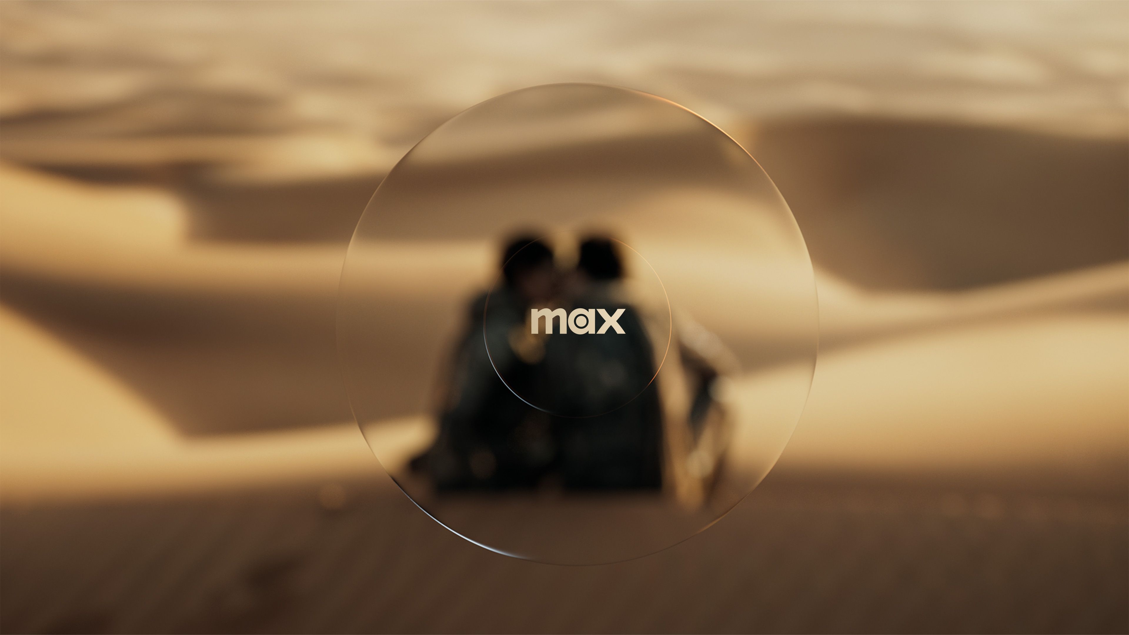 Brand keyframe: transparent circle lens motif over rack focused still from Dune, wordmark centered in edge-lit clear logo overlay
