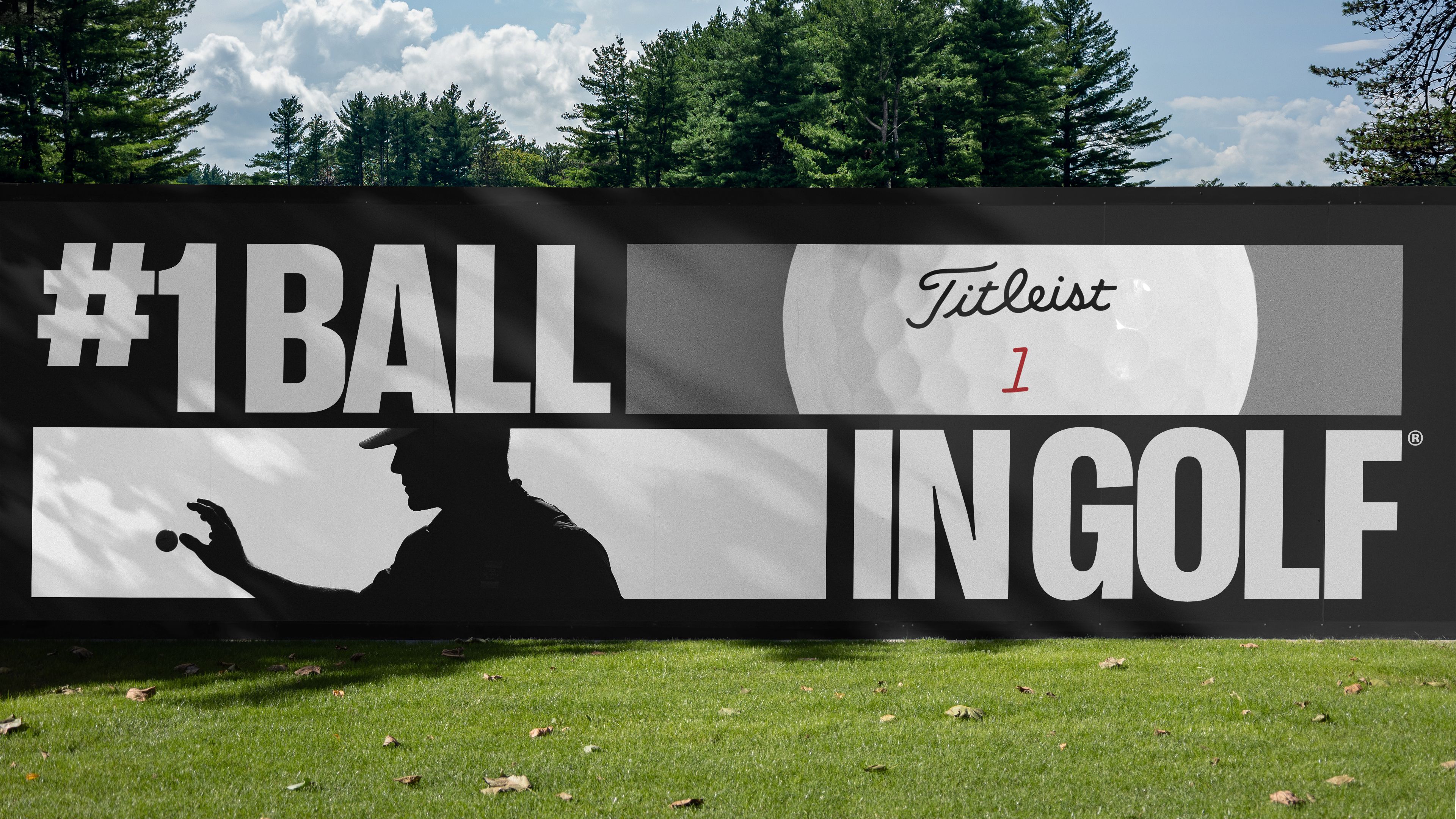 Large black course banner reading “#1 Ball in Golf” with a close-up of a Titleist ball and a silhouetted golfer holding out a ball.