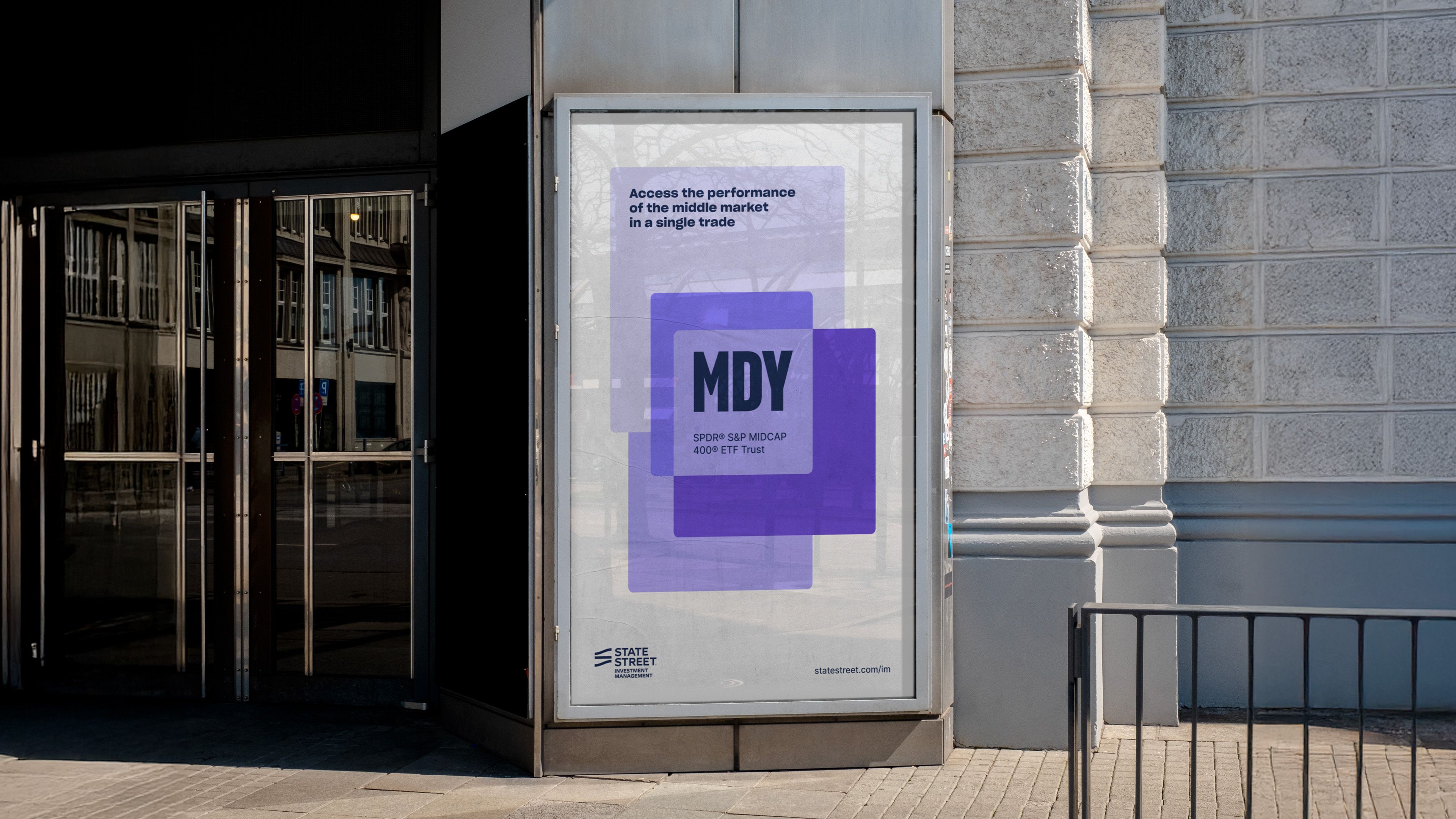 MDY ETF OOH lightbox: layered purple rectangles, 'MDY / SPDR S&P MIDCAP 400 ETF Trust / Access middle market'