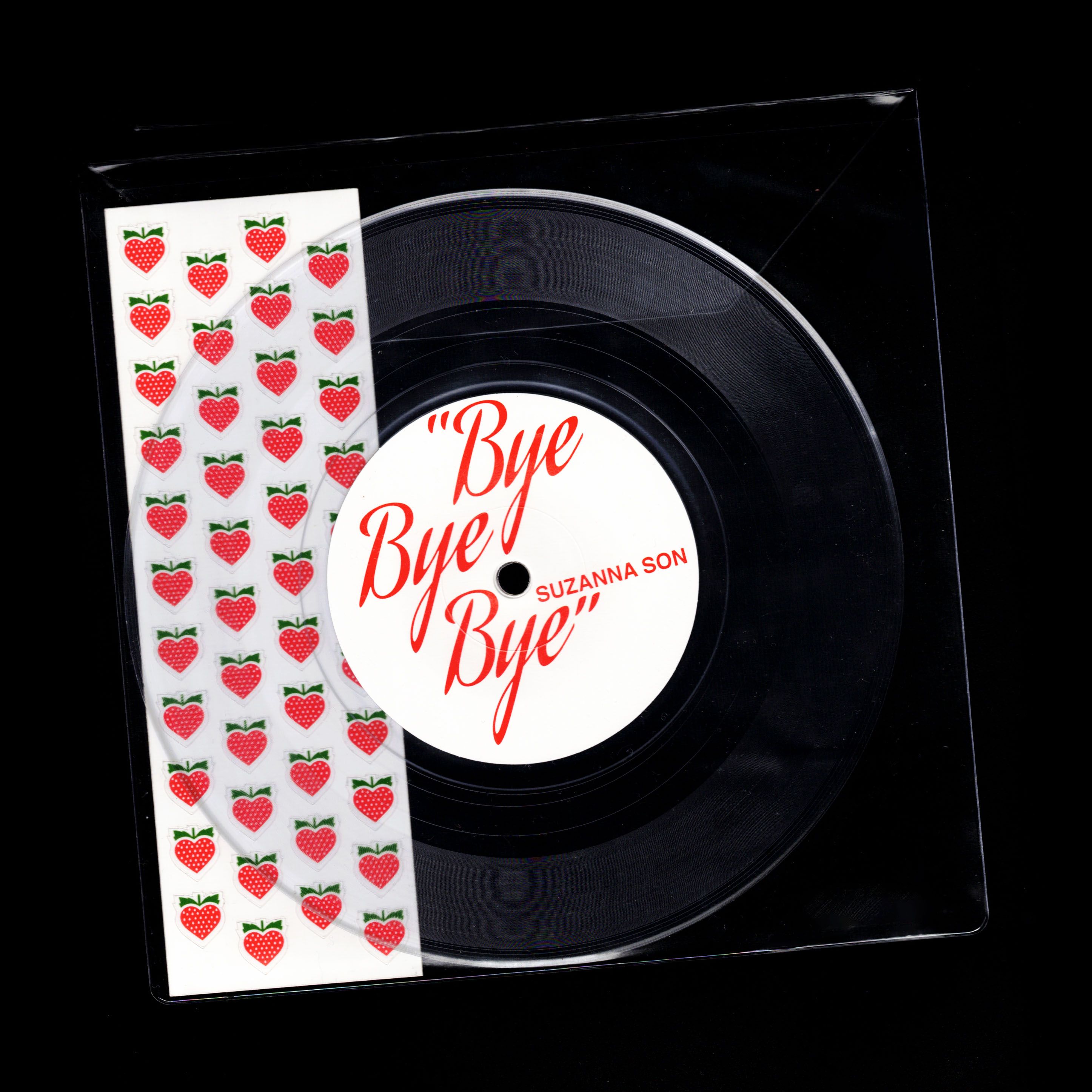 Scanned Red Rocket "Bye Bye Bye" clear 7" in sleeve: Side B, strawberry-heart paper sticker insert
