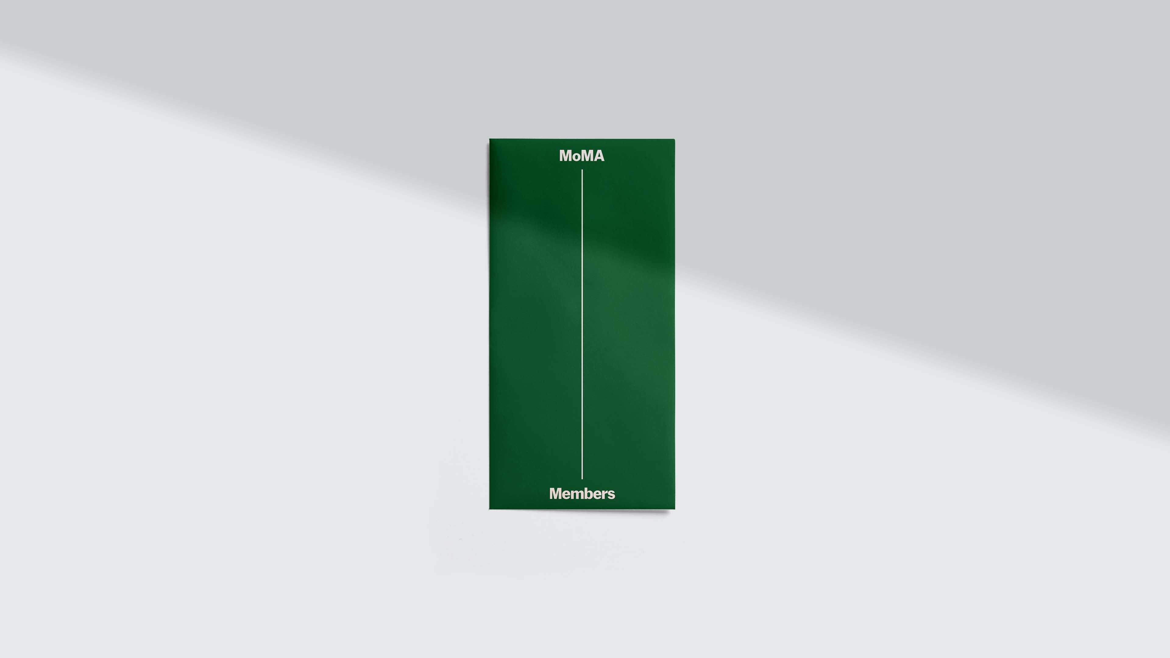 MoMA Members membership card envelope mailer, deep green with "MoMA" at top and "Members" at bottom connected by a vertical line in cream