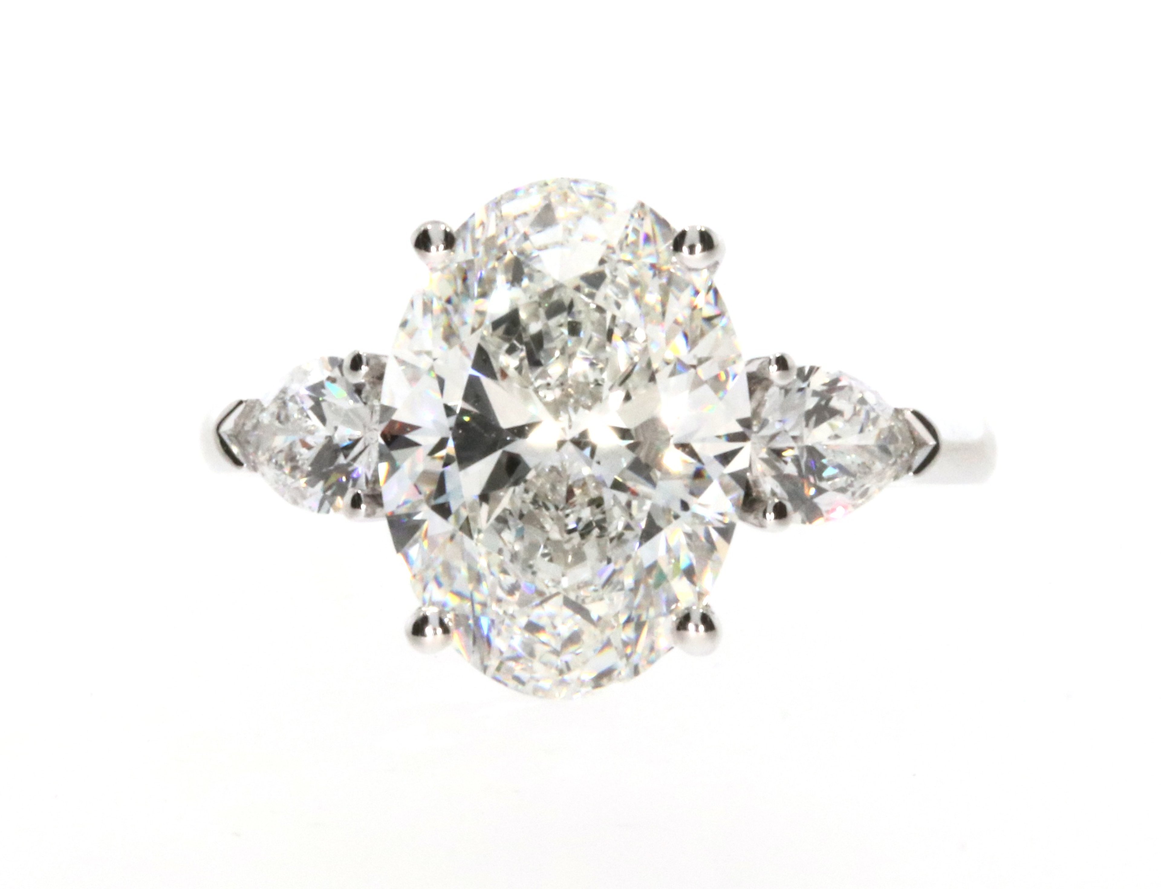 Oval & Pear Three-Stone Ring
