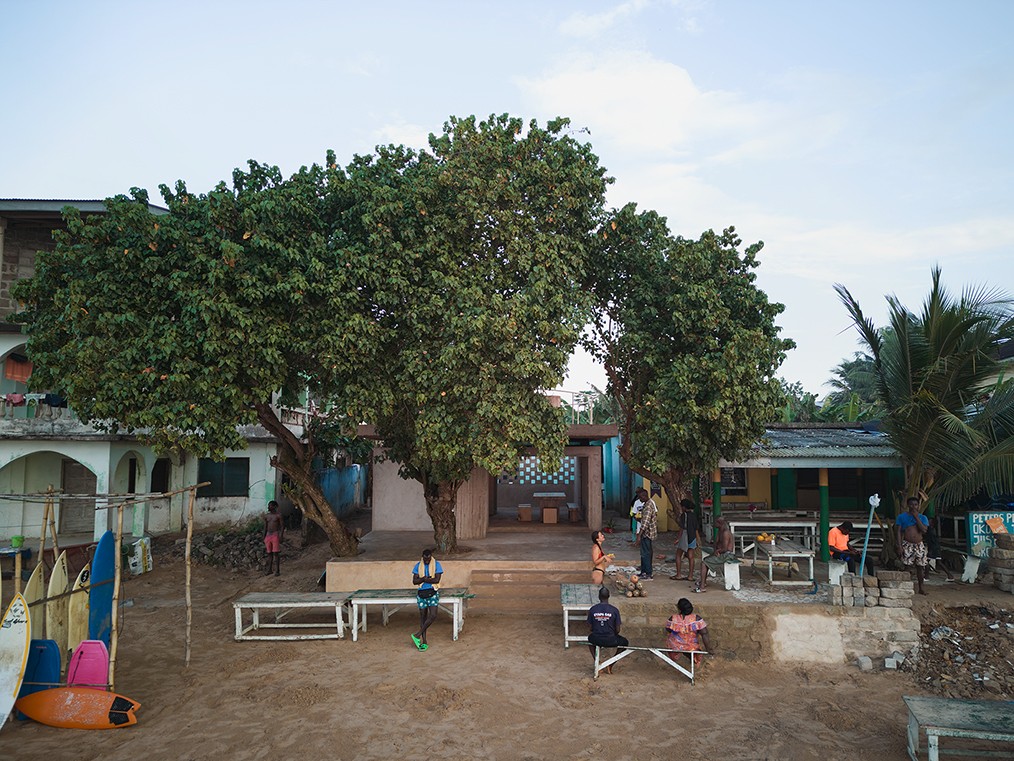 Trees overlook a collection of tables