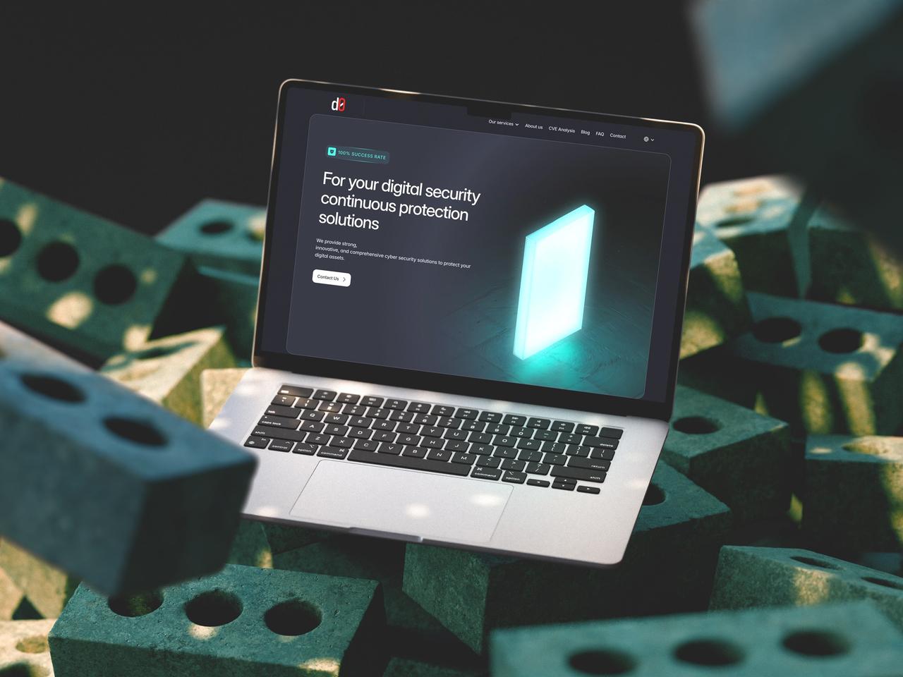 Laptop on green bricks showing the RedCyber homepage hero with a glowing teal 3D shape and “100% success rate” badge