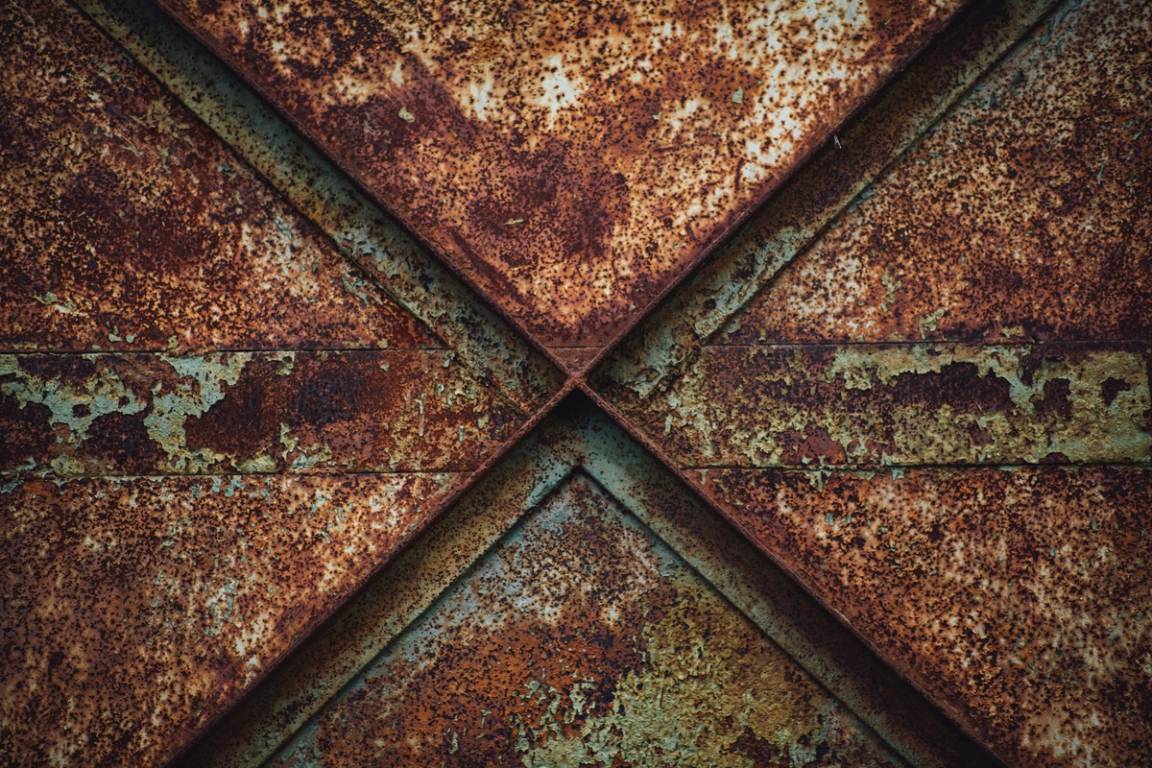 A photo of a rusty door with a zigzag pattern