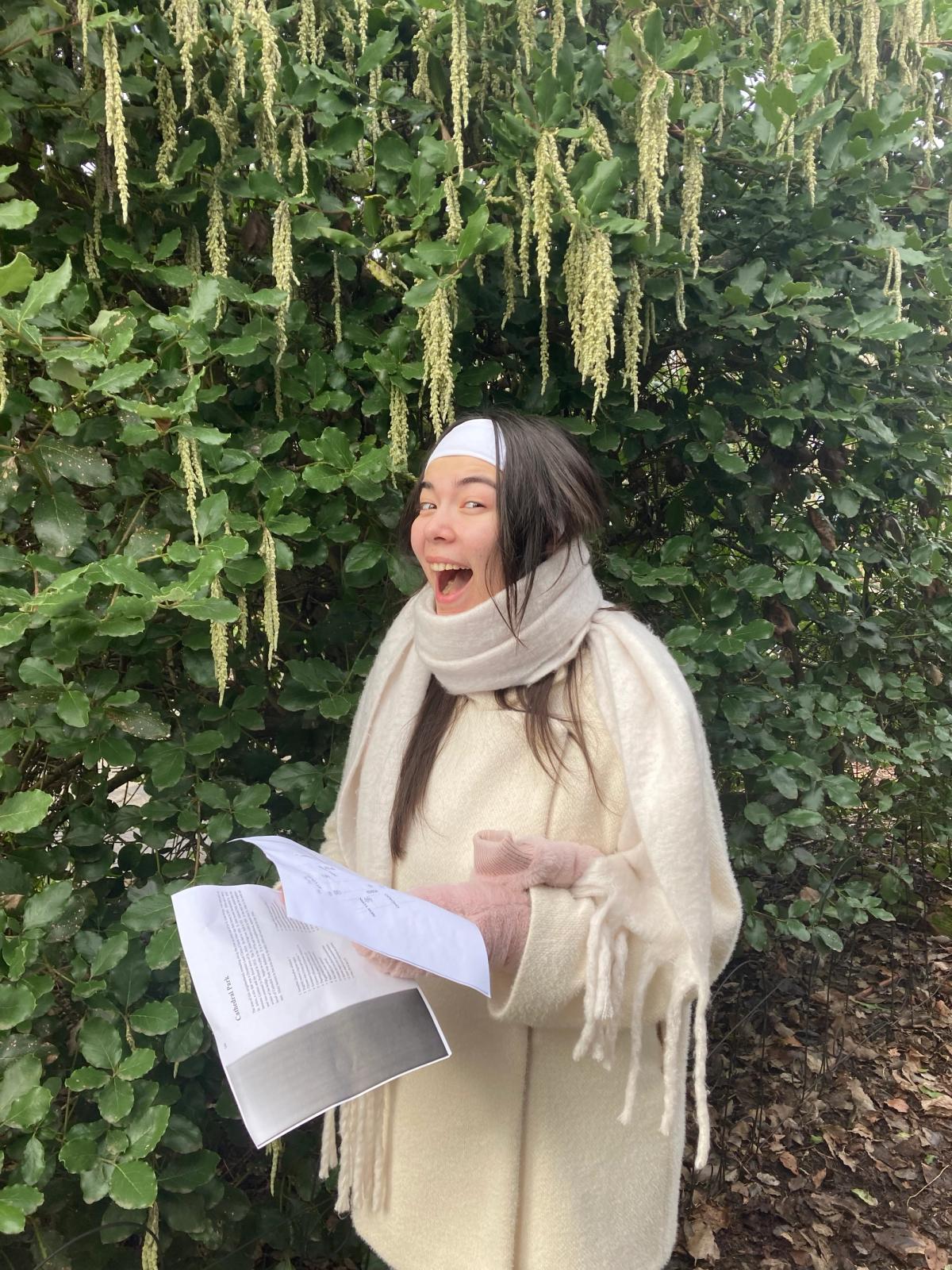 Daughter S posing beneath Garrya elliptica