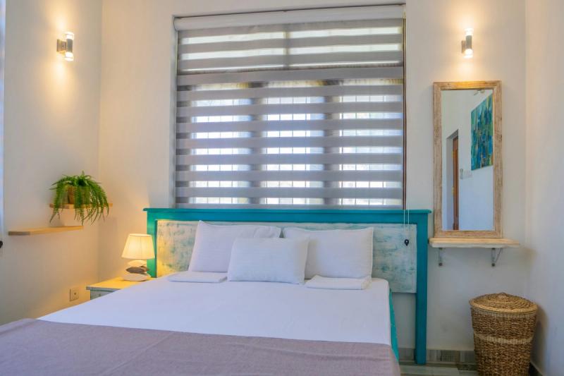 How To Decorate a Guest Bedroom: Layer Lighting Instead of Relying on One Sad Overhead Fixture
