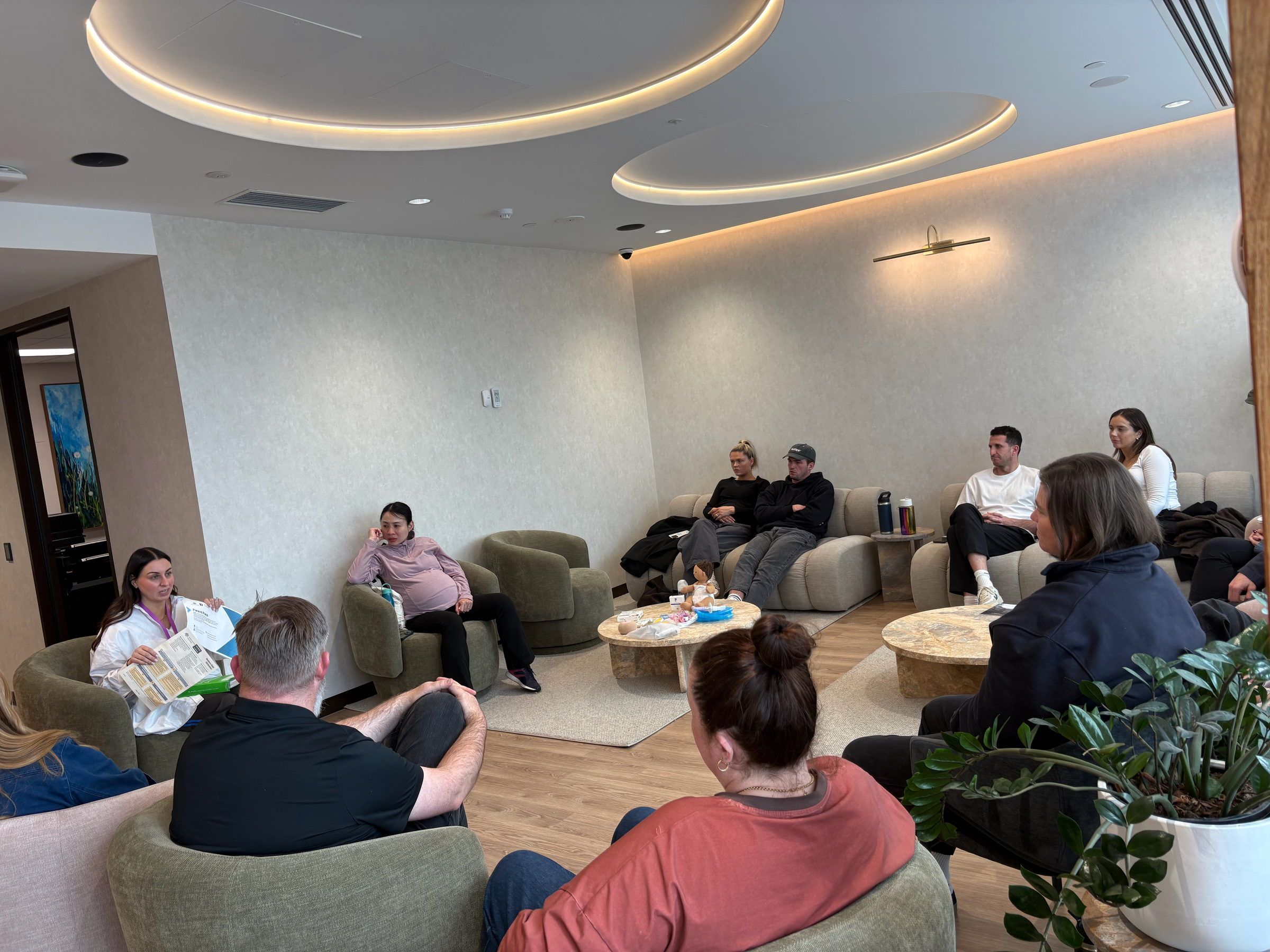 Expectant parents at a birth education session in the Origia lounge