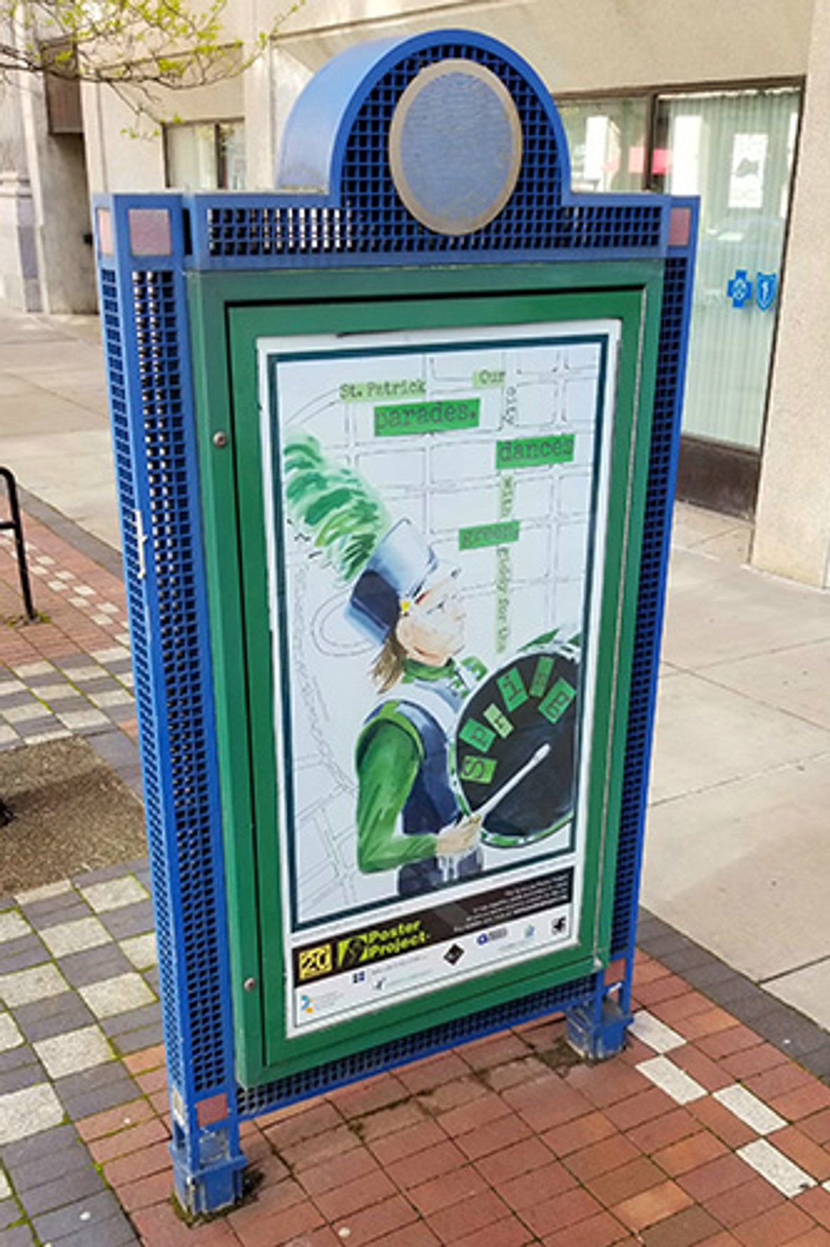 A kiosk with a poster of a soldier playing a drum