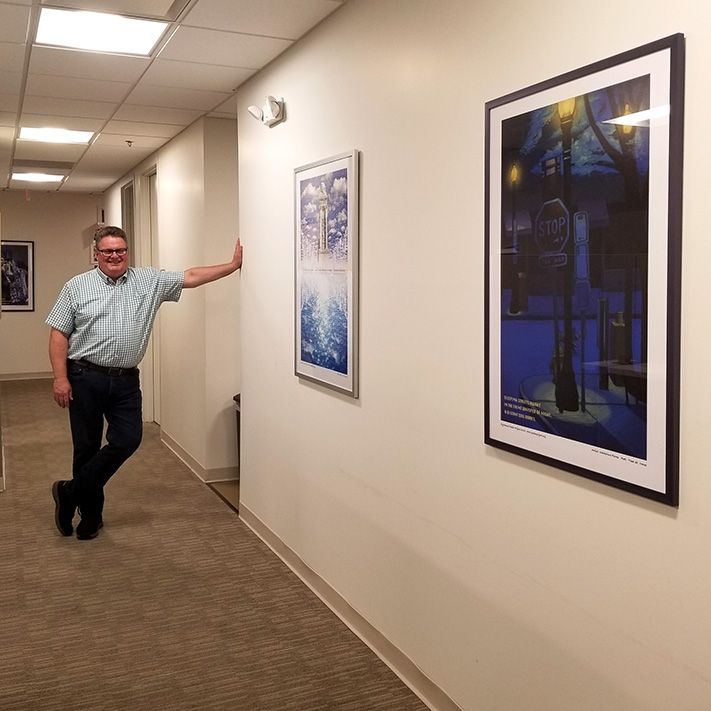 Jan Quitzau with framed posters