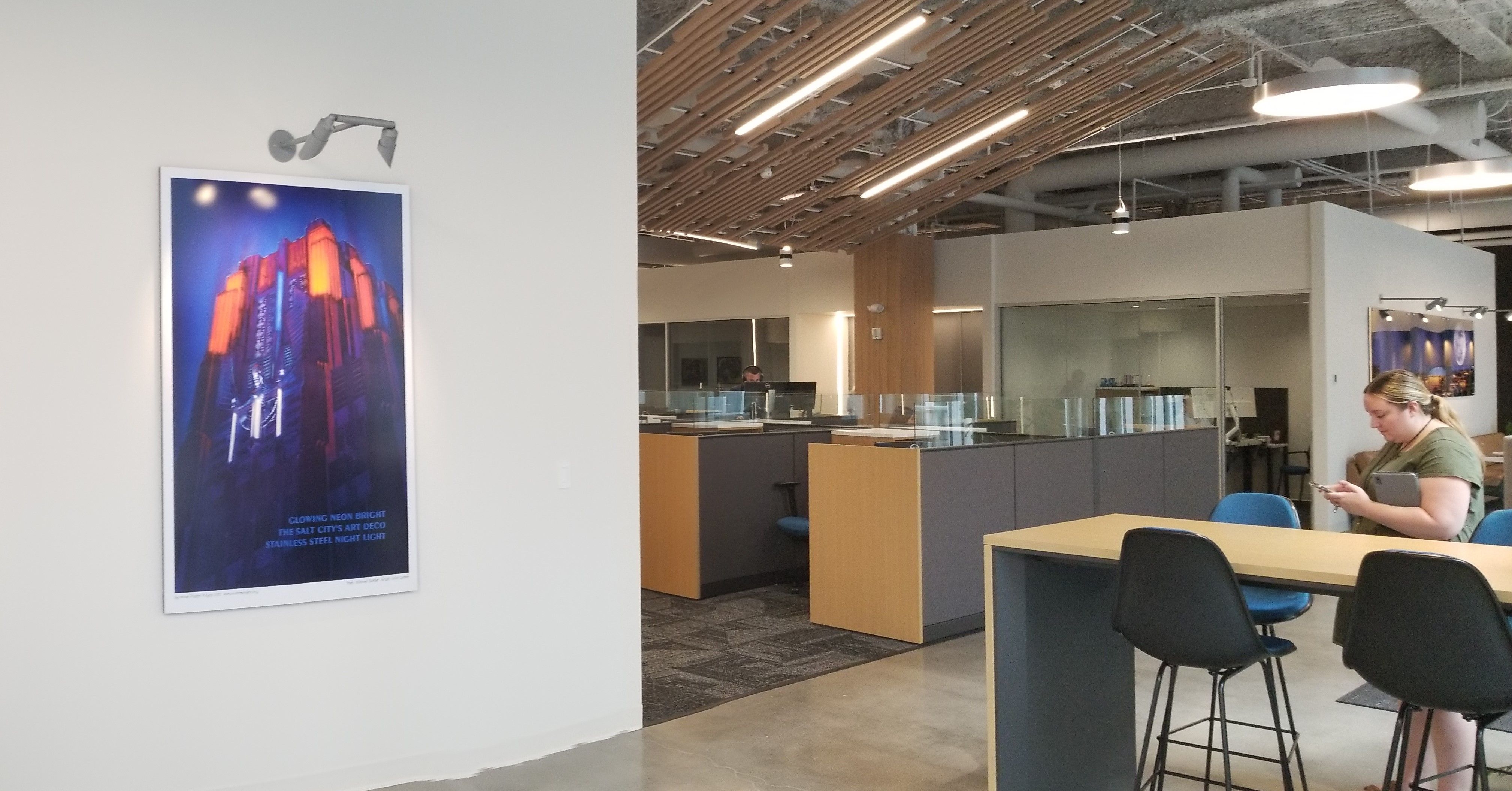 Large-format poster panel of NiMo Building in the office of CXtec