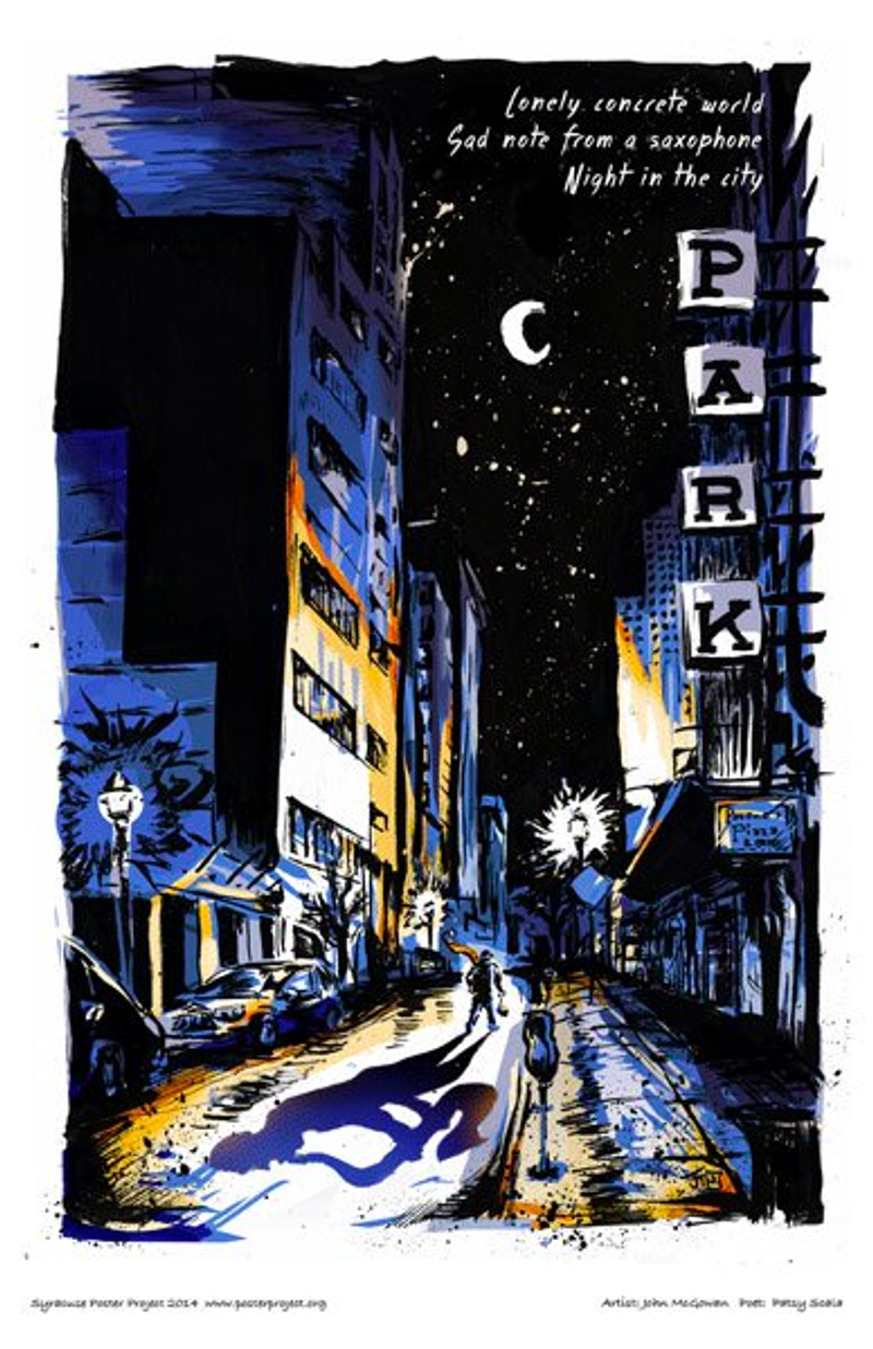 A saxophonist plays in the middle of an urban street at nighttime