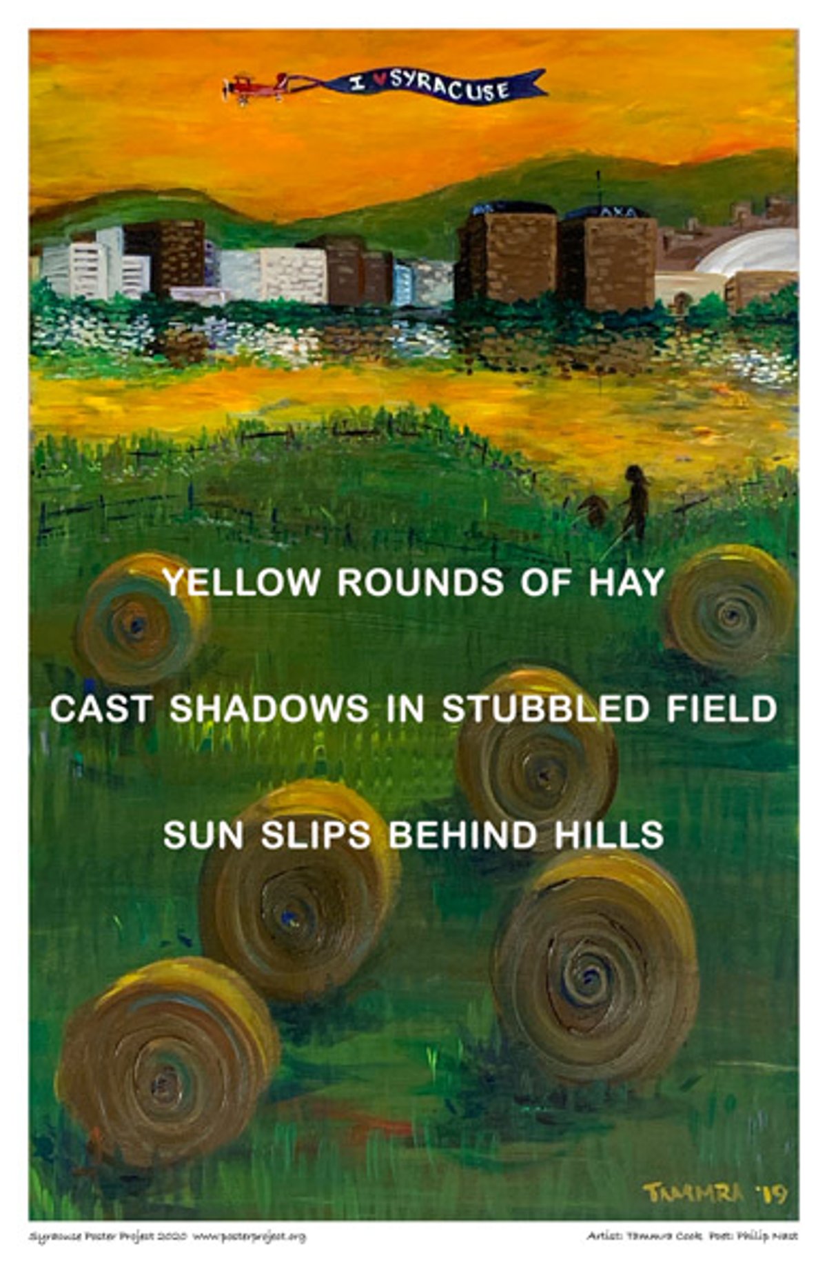 yellow rounds of hay
cast shadows in stubbled field
sun slips behind hills Bales of hay on a field with a city scape in the distance beneath a plane trailing a banner that reads "I *heart* Syracuse"