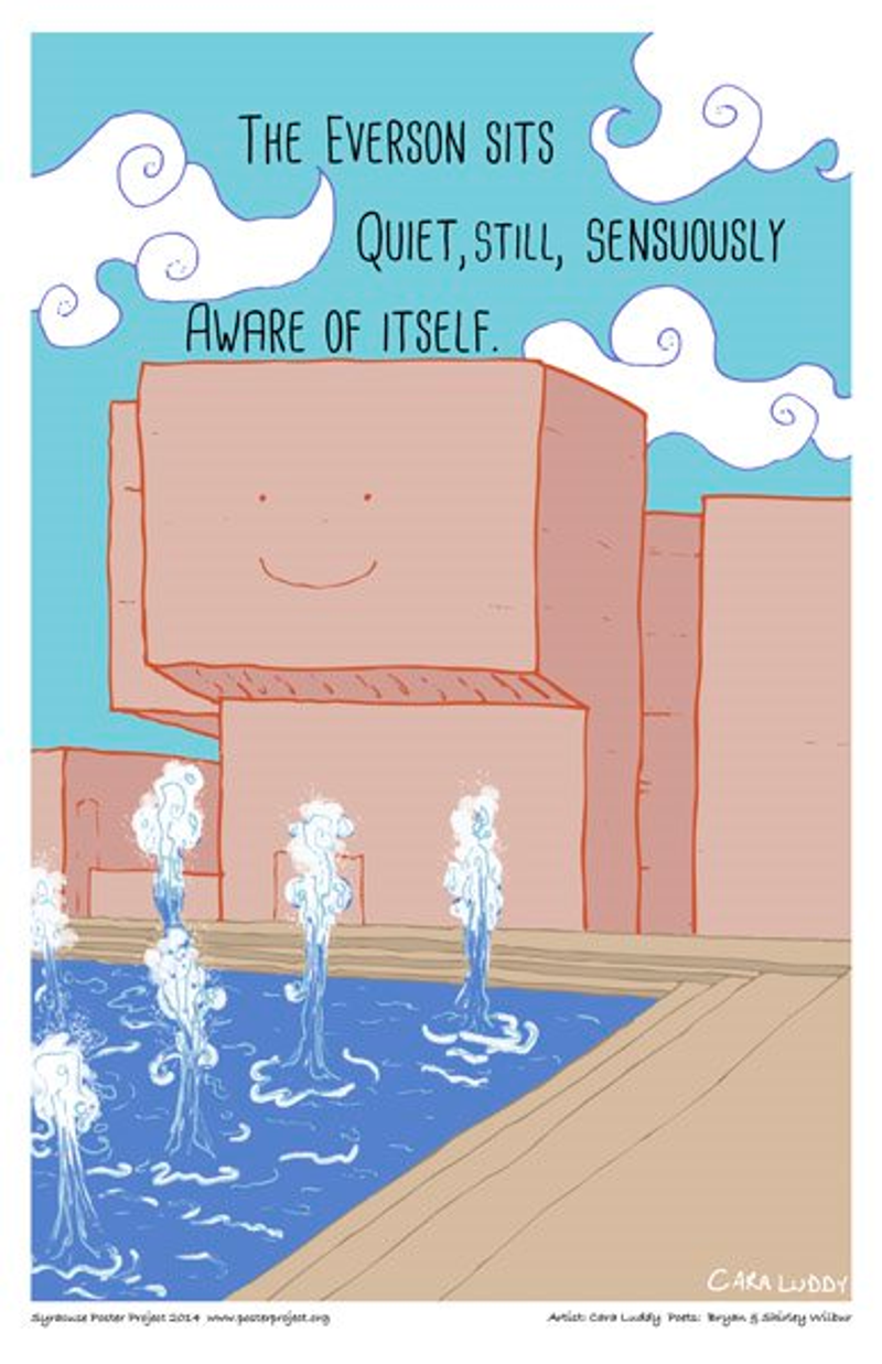 A windowless building with a simple smiley face overlooks a pool with water spouts