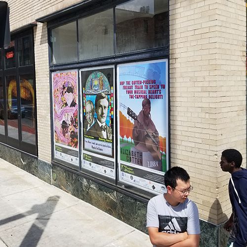 Jianghui Li and poster panels at Landmark Theatre