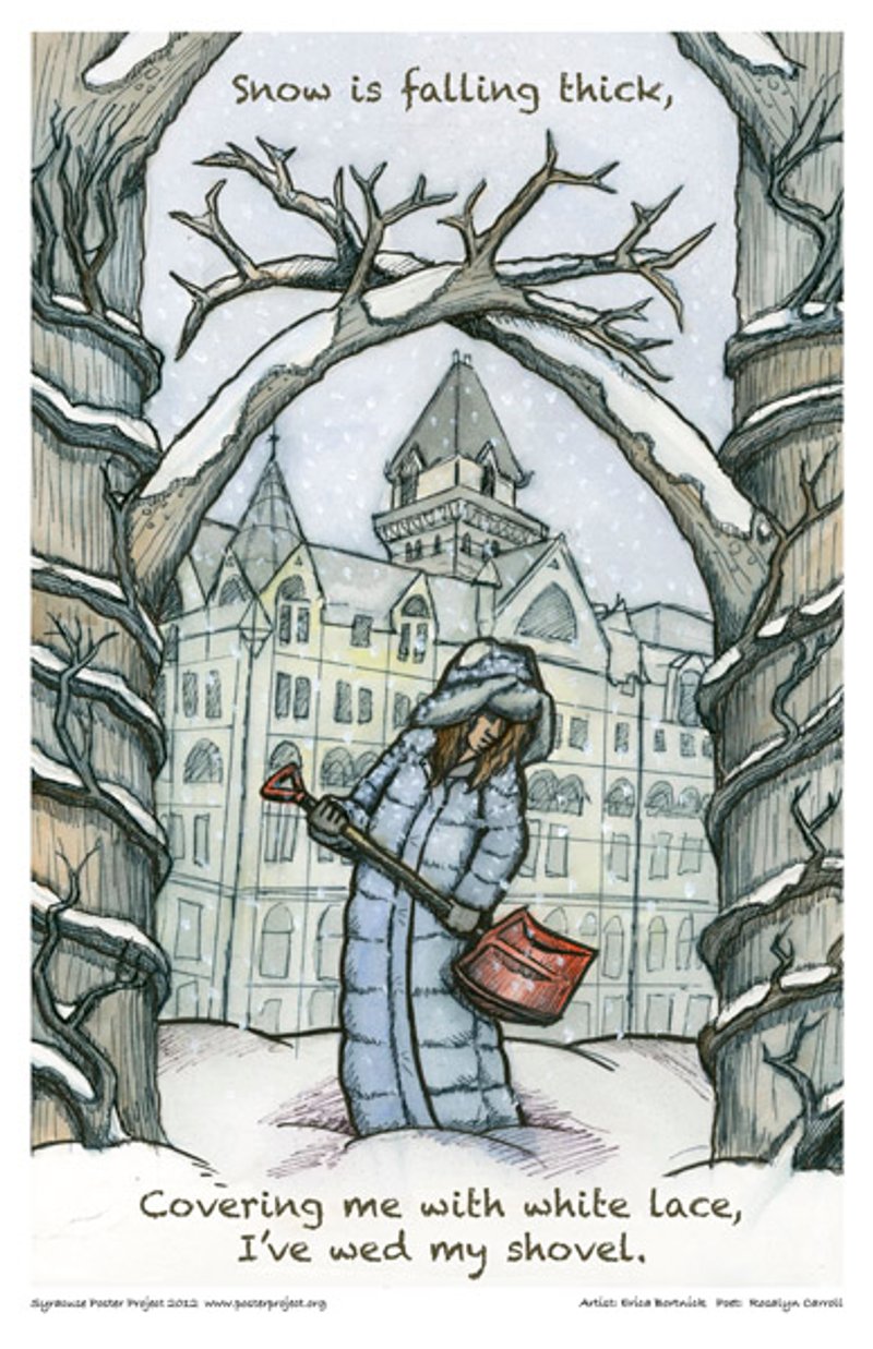 A woman in a warm long coat shovels snow beneath snow covered tree branches