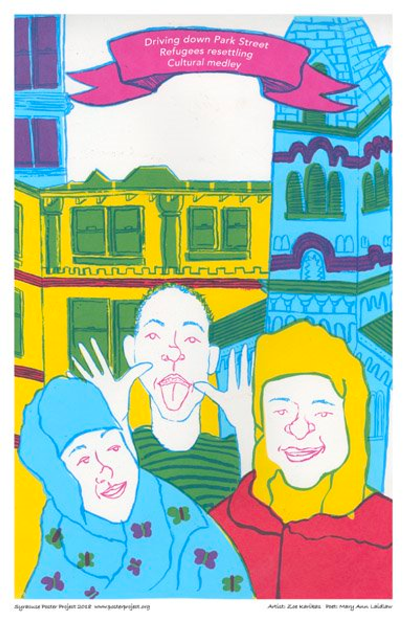 Three people stand in front of colorful buildings