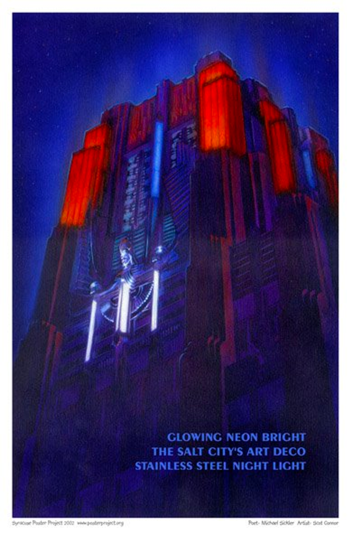 An art deco city building is lit up in red light at nighttime