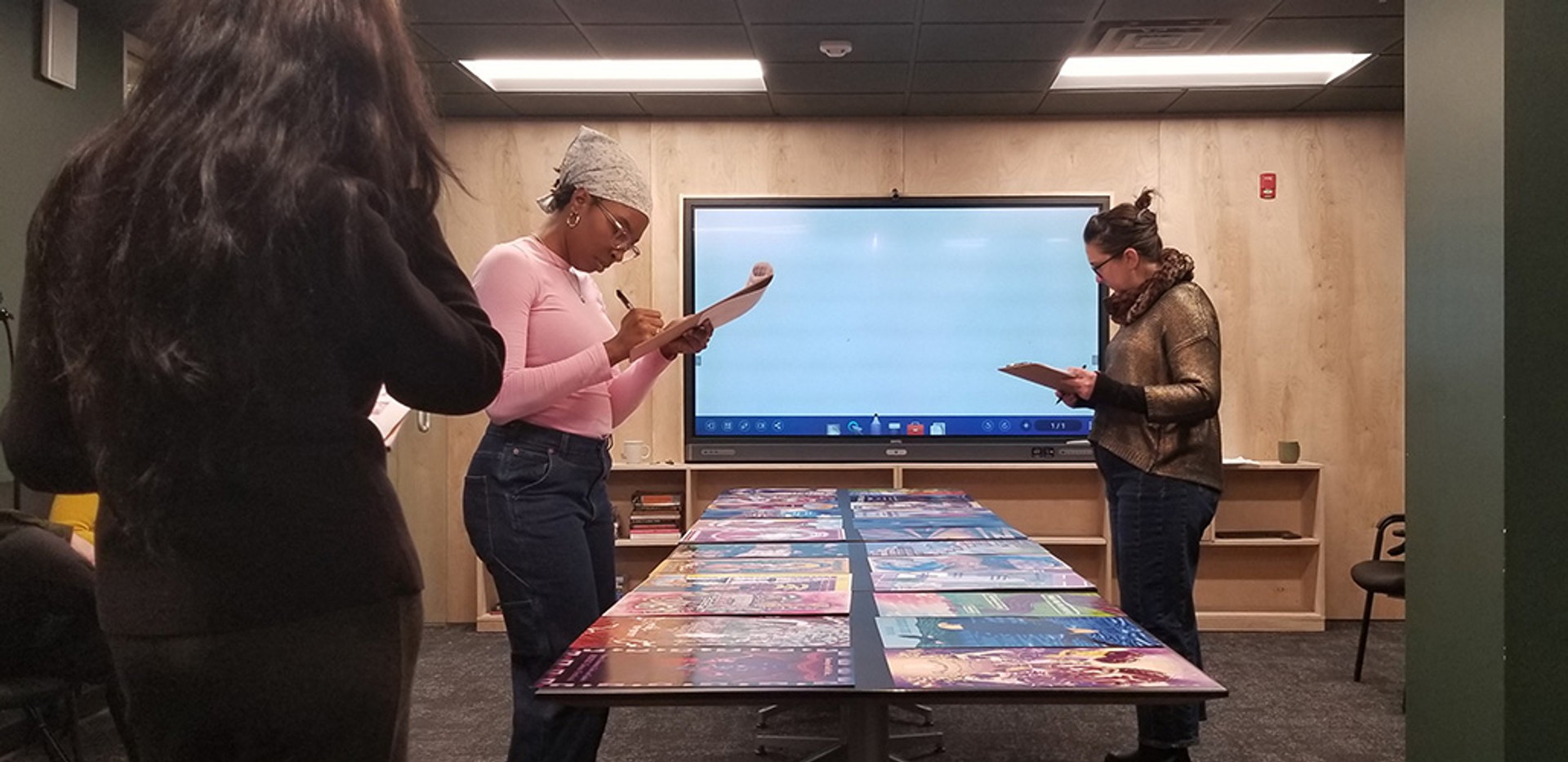 Panelists reviewing poster submissions for the 2026 poster series