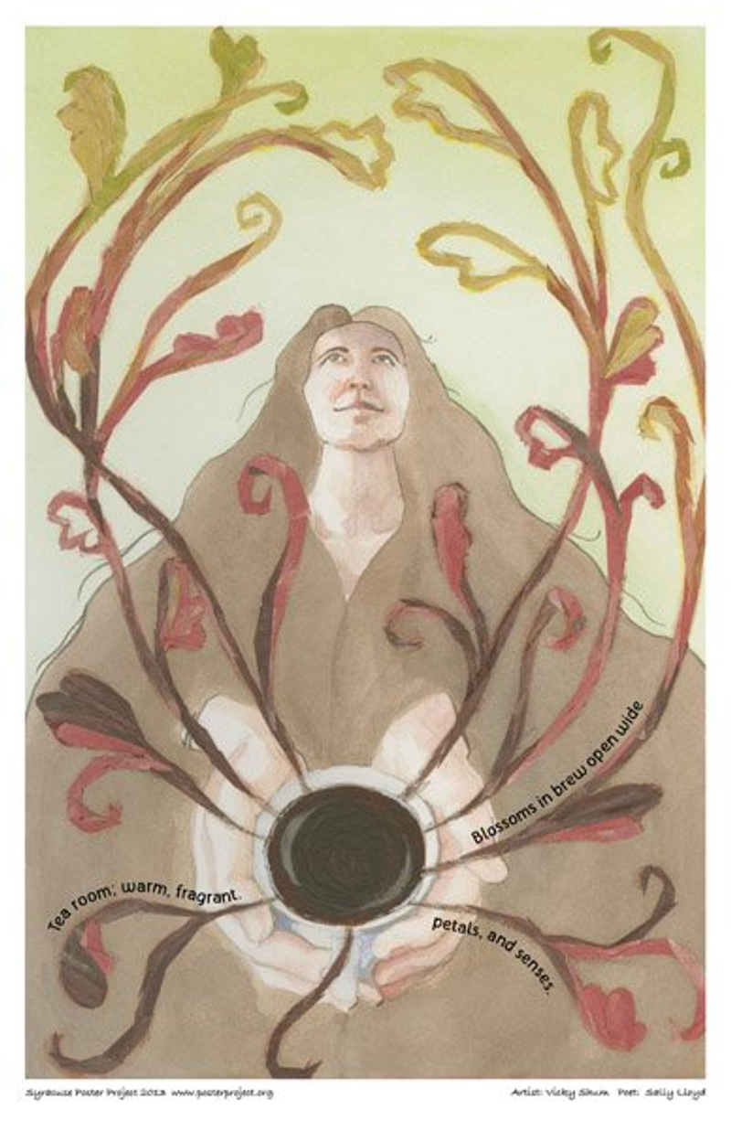 A woman is surrounded by the aroma from a warm cup of tea in her hands