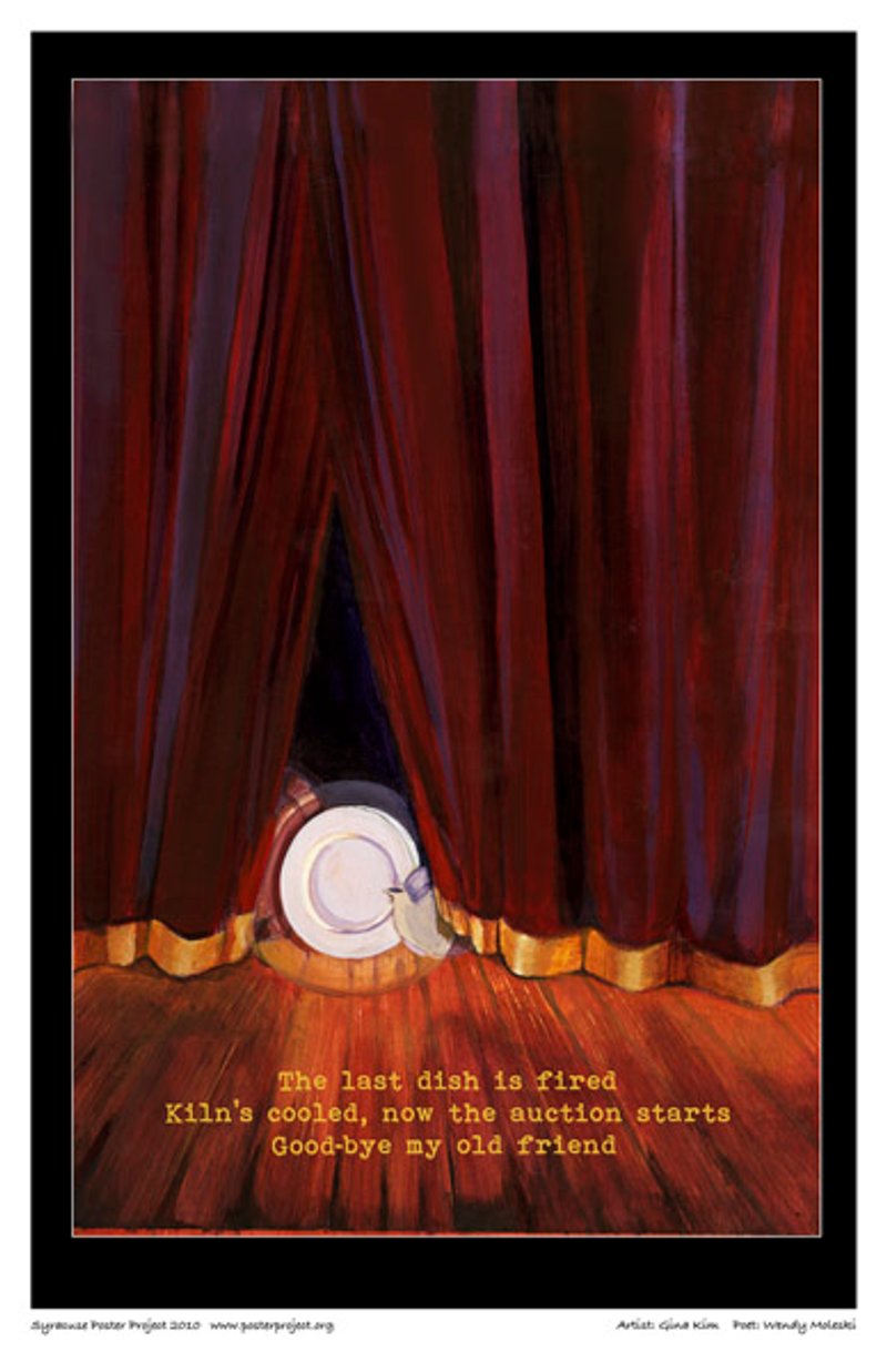 A plate and kettle peak out through closed stage curtains