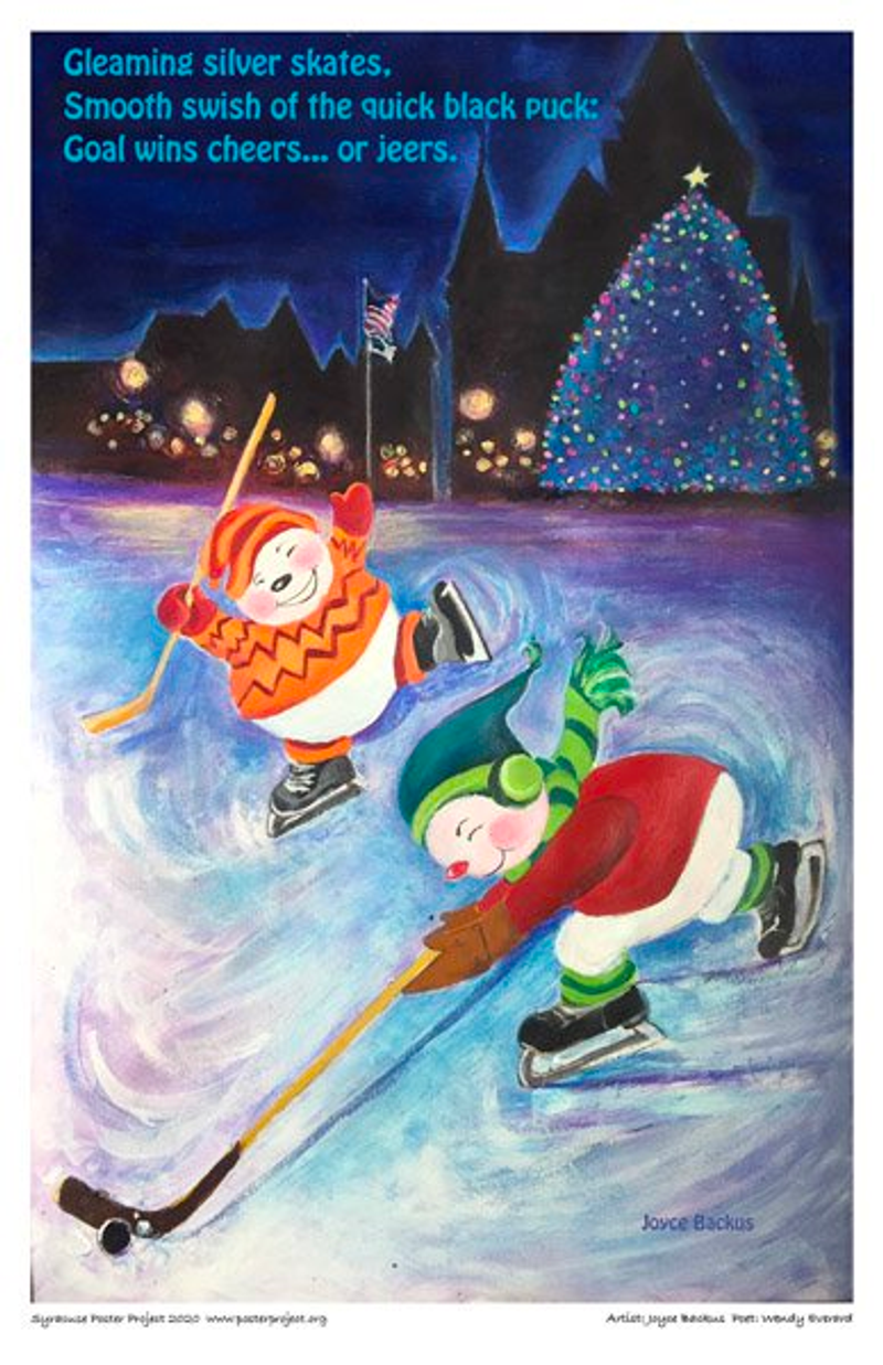 Two children play hockey at night at a city park in front of lit up Christmas tree