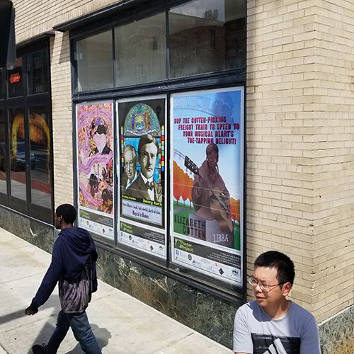 Jianghui Li and poster panels at Landmark Theatre