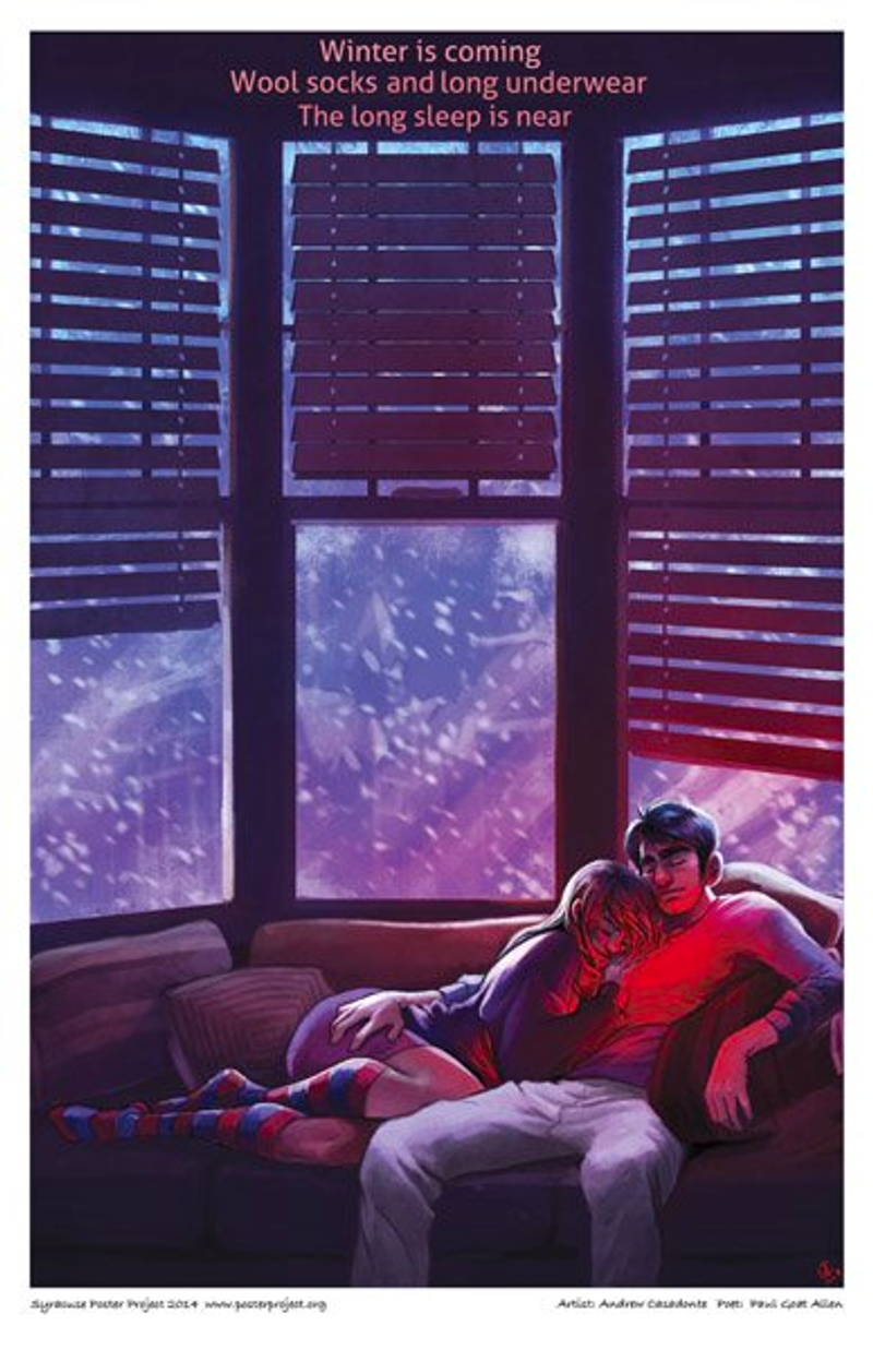 A couple doze together on a couch as snow blows outside the windows behind them