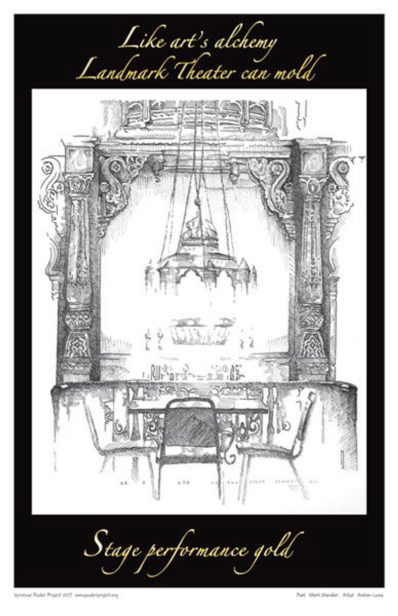 An empty table and chairs sits under a chandelier in front of an empty stage