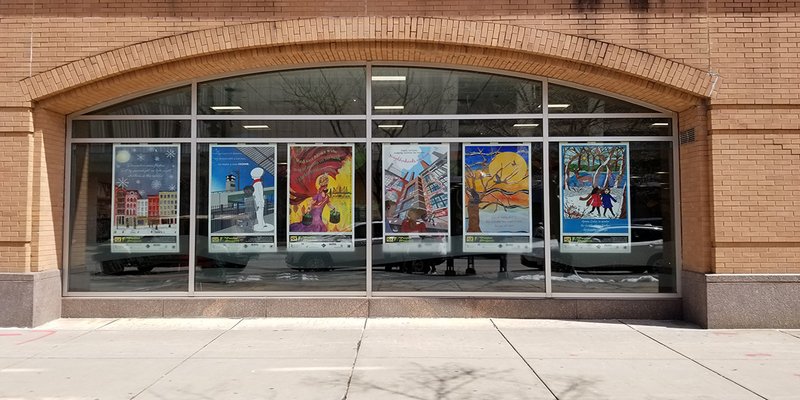 Six kiosks on the windows on the side of a building