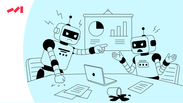 The image features two robots sitting at a table with laptops and other computer equipment on it. One of the robots is pointing towards something on the laptop screen while the other robot appears to be engaged in conversation with its companion. The scene suggests that these robots might be working together, possibly as part of an office or collaborative setting.