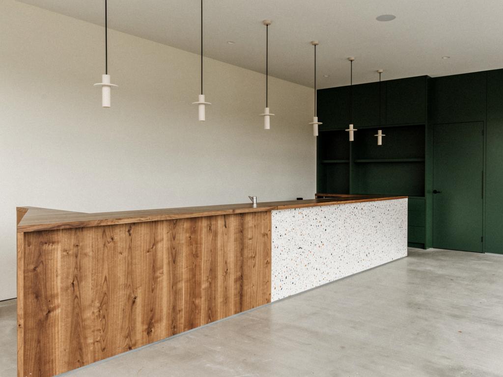 A completed café fitout with a timber servery counter, illustrative of the building type