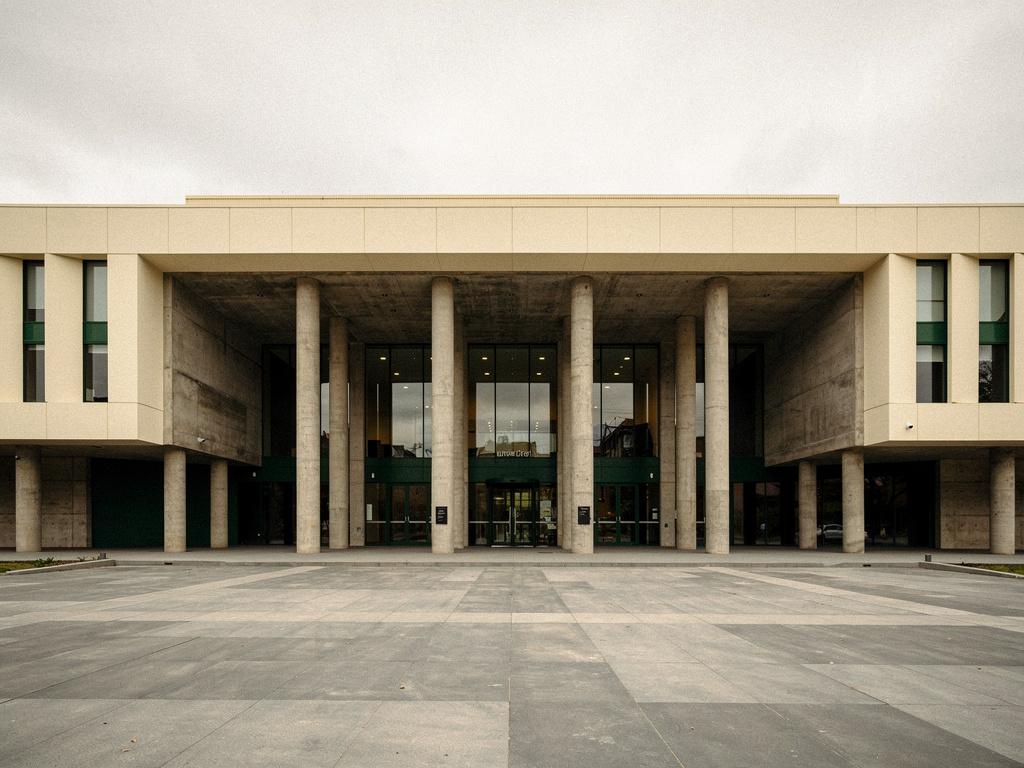 A completed civic building entrance with a colonnade, illustrative of the building type