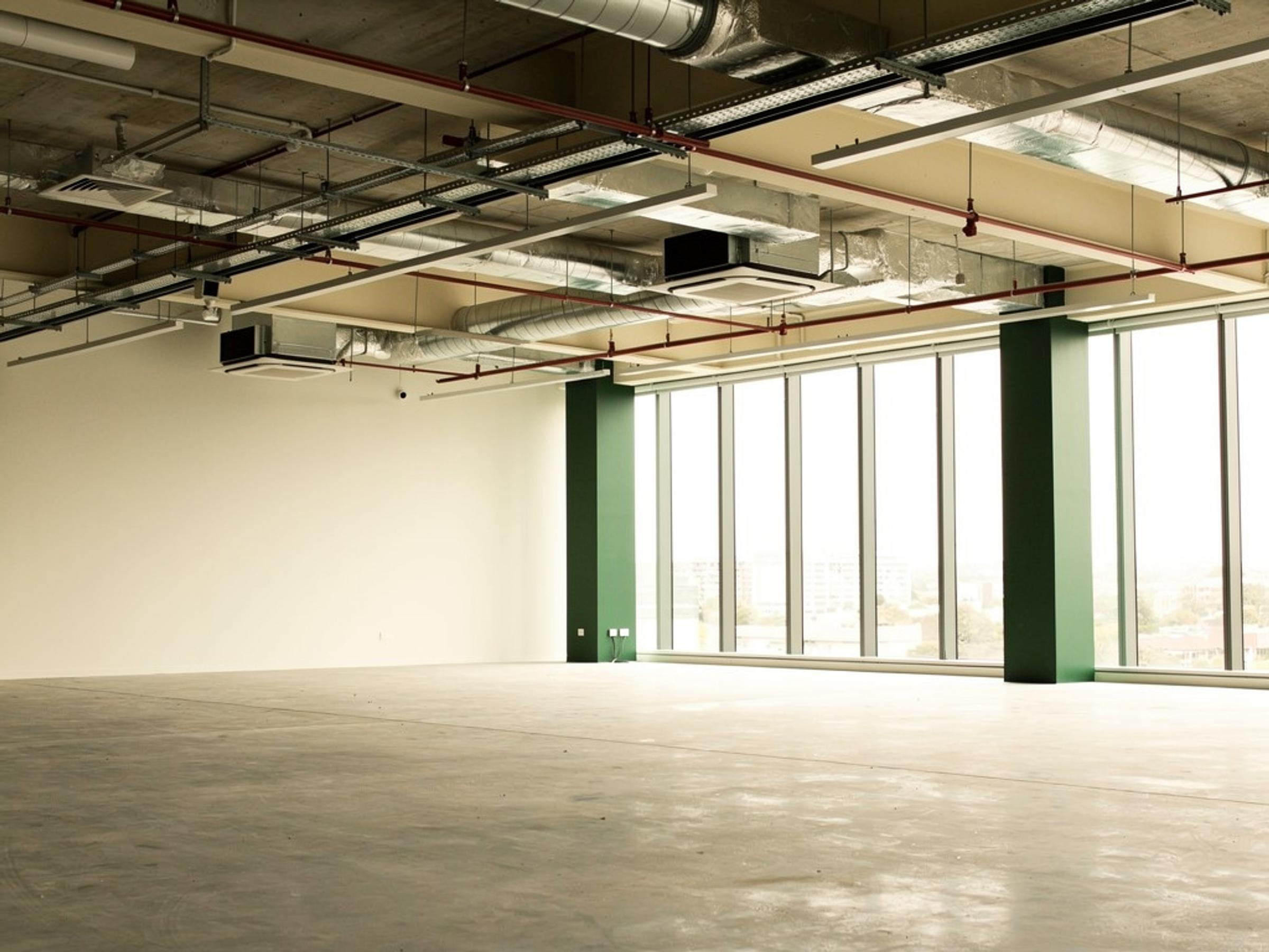 An empty commercial tenancy stripped back to base building, illustrative of the building type