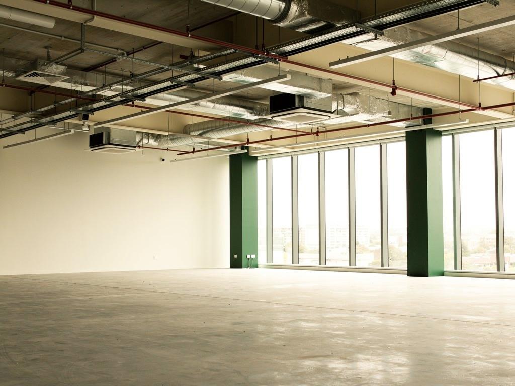 An empty commercial tenancy stripped back to base building, illustrative of the building type
