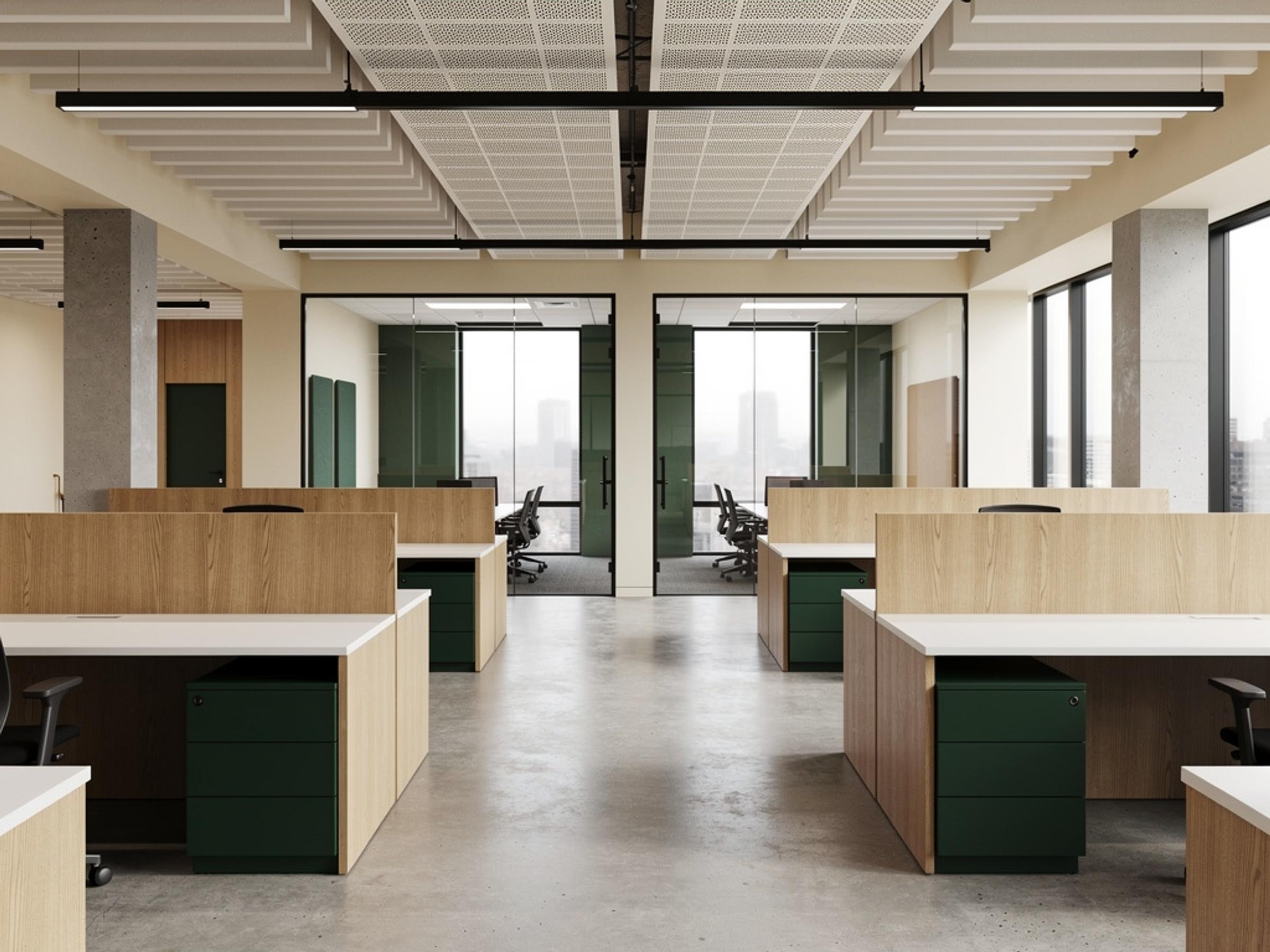 A completed open-plan office fitout with a glass-walled meeting room, illustrative of the building type