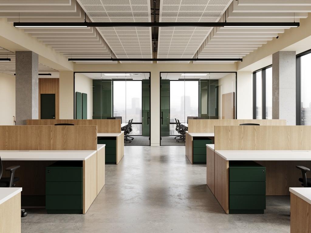 A completed open-plan office fitout with a glass-walled meeting room, illustrative of the building type
