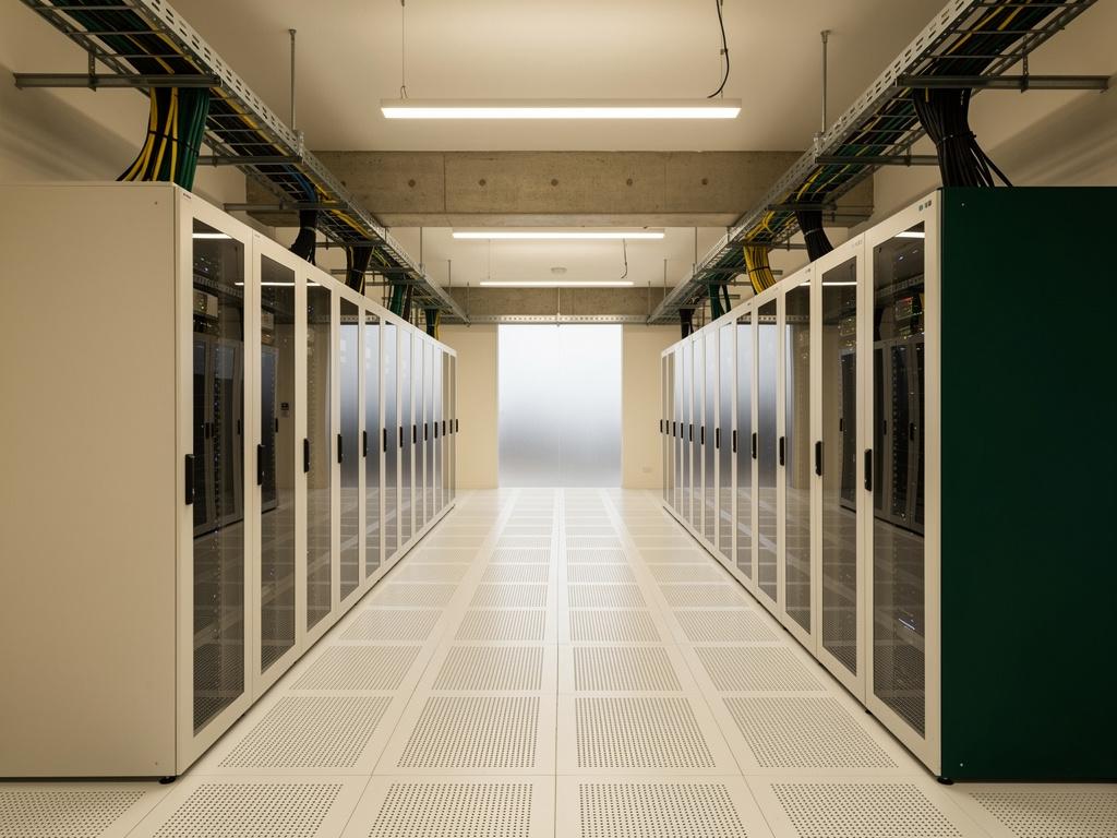 A completed small data hall with rows of server cabinets, illustrative of the building type
