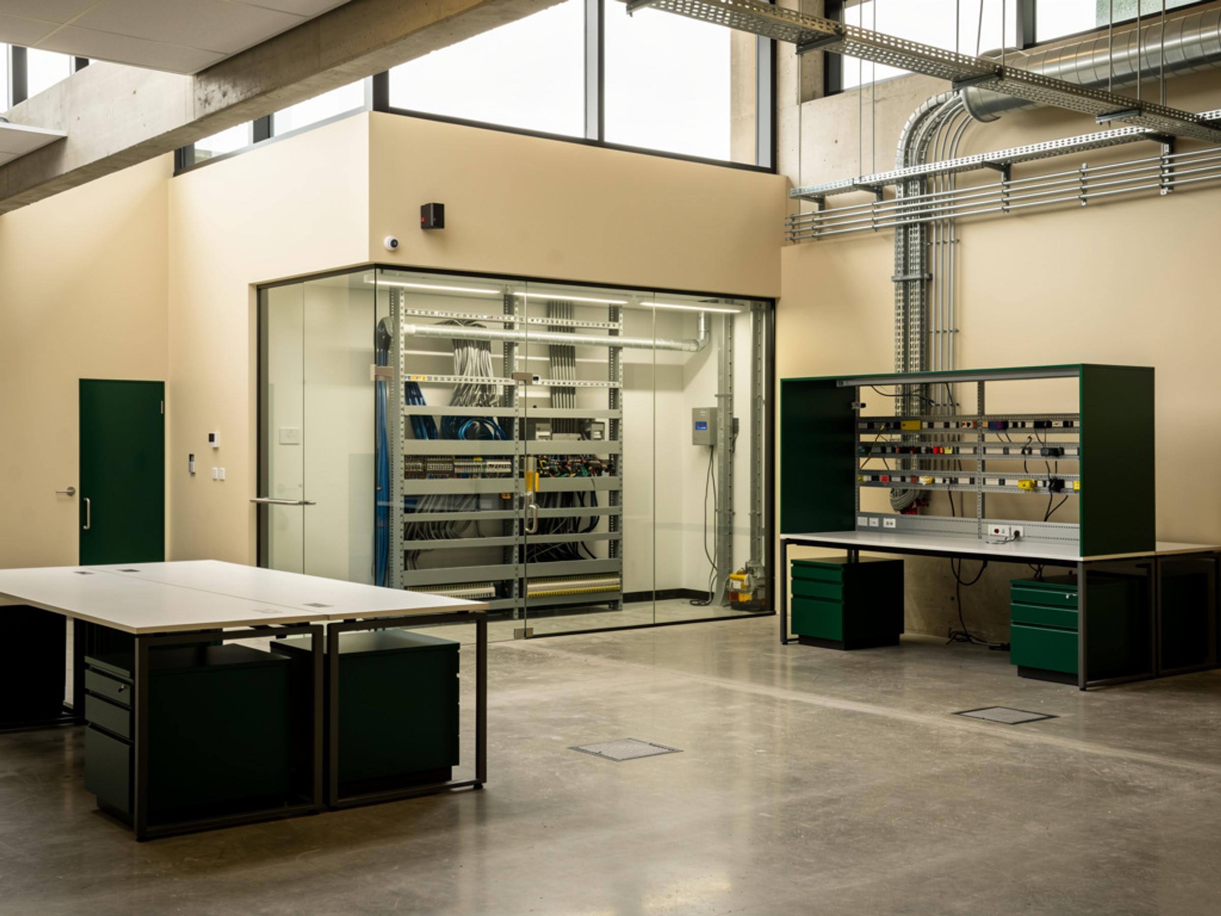 A completed technology workplace with a glazed equipment room, illustrative of the building type