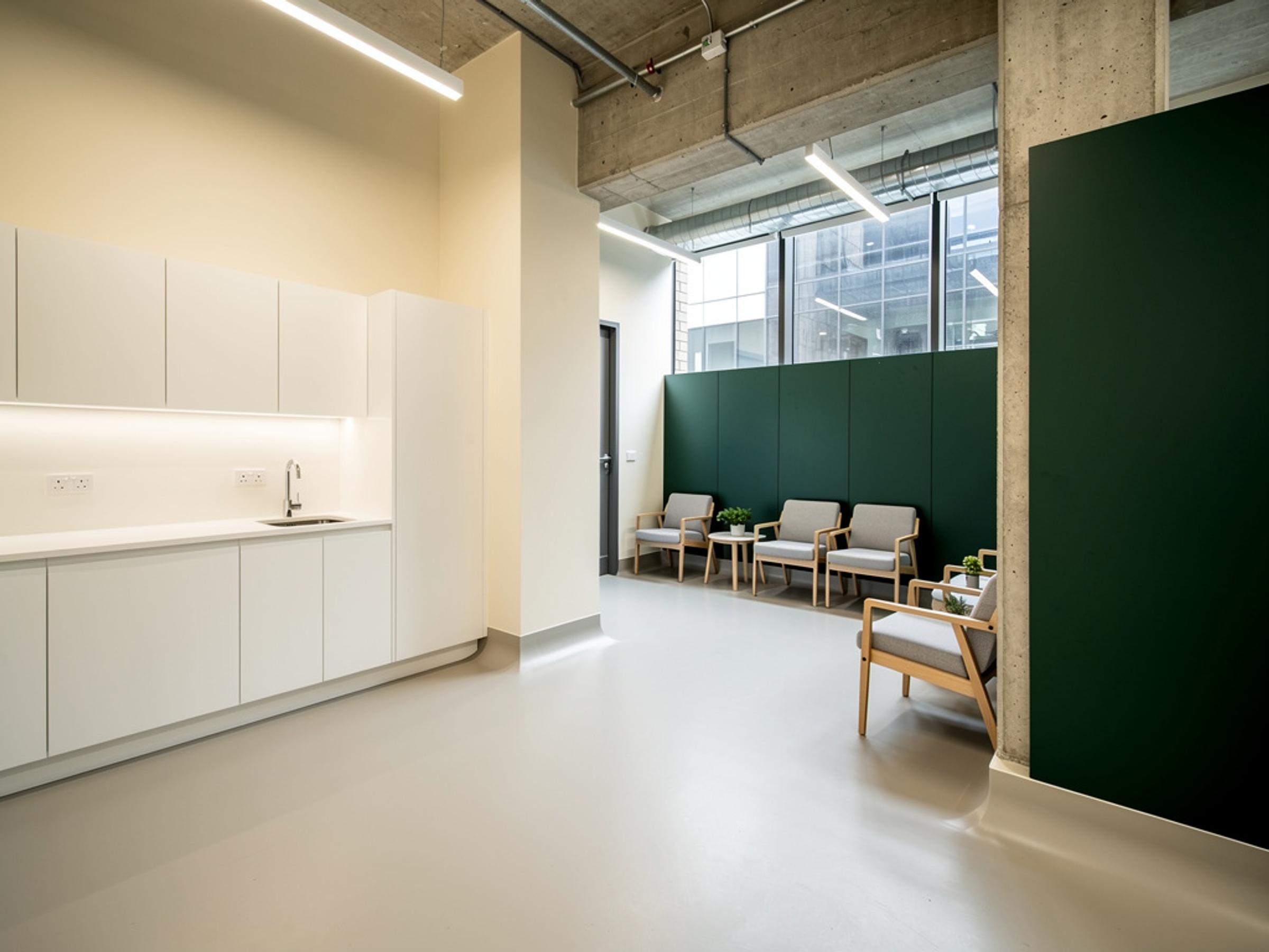 A completed medical consulting suite with a clean treatment room, illustrative of the building type