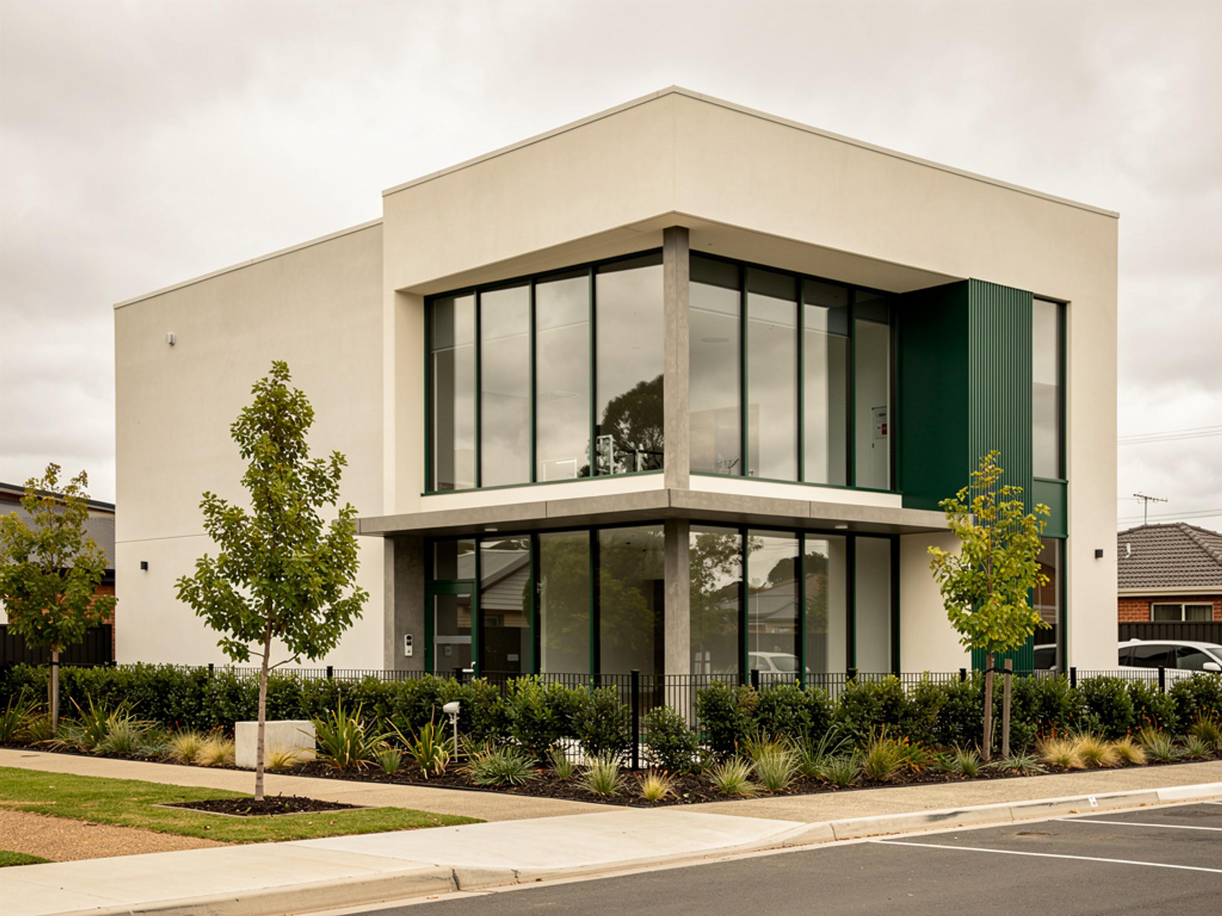 A completed two-storey commercial building in precast concrete and glass, illustrative of the building type