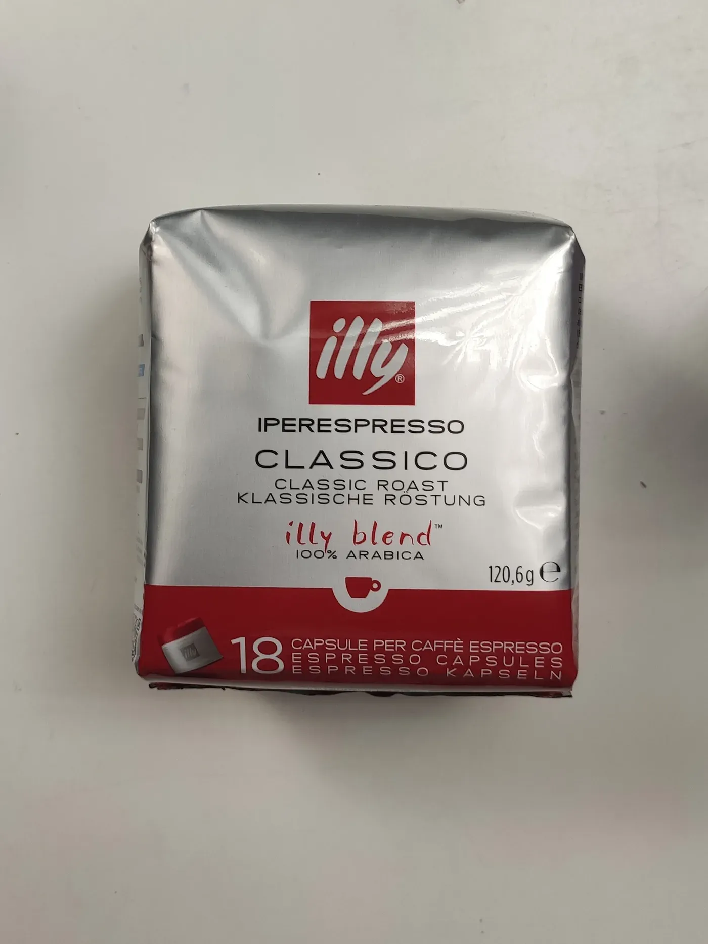 Original studio photo of an illy Iperespresso Classico coffee capsules pack on a plain background