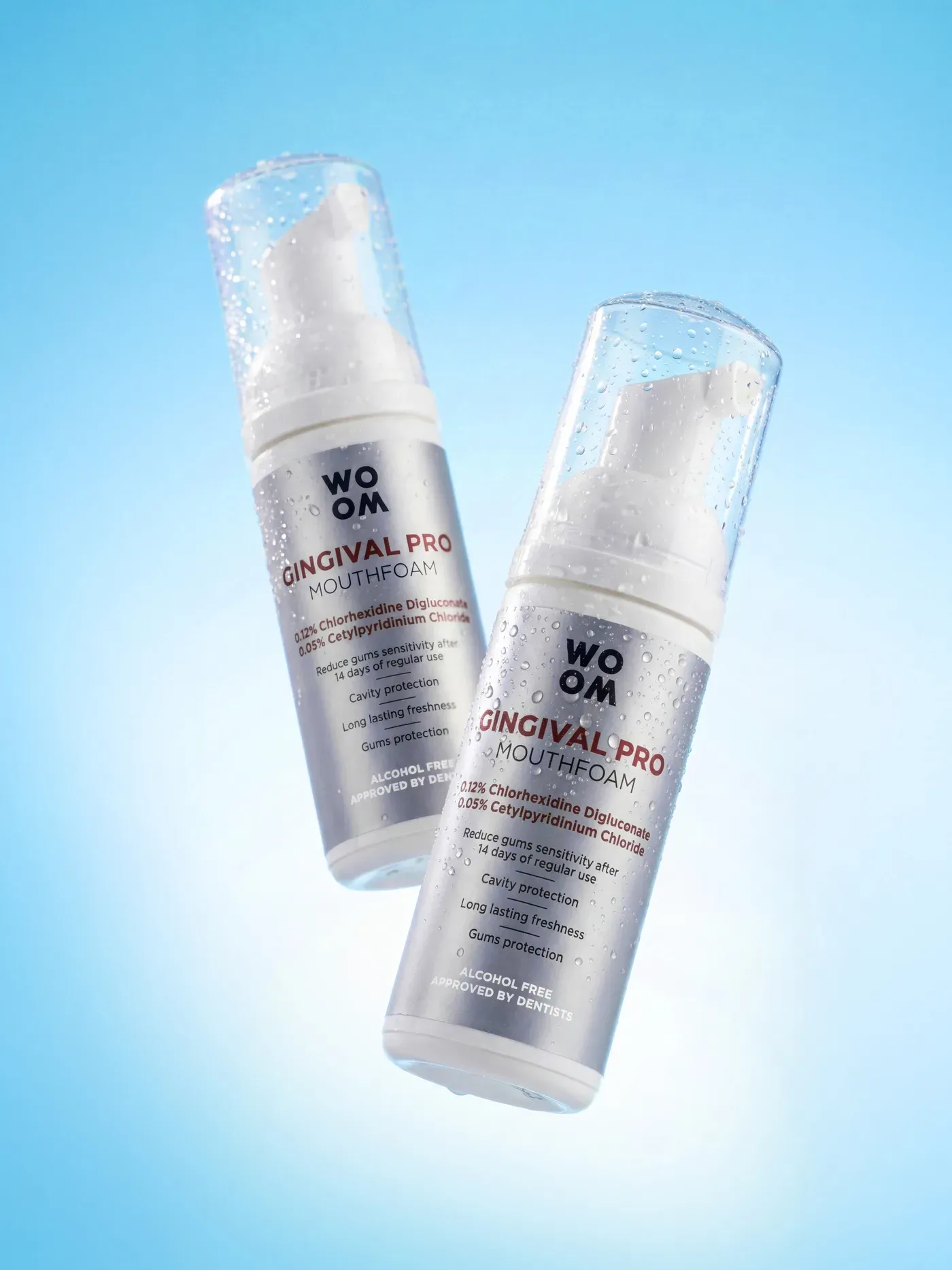 AI-generated advertising photo of the Woom Gingival Pro mouthfoam bottles falling through water with splashes
