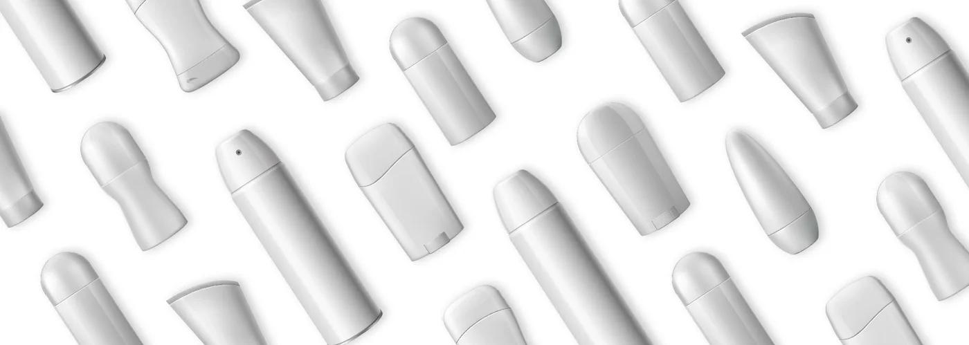 Repeating pattern of white deodorant and cosmetic tube mockups on a white background