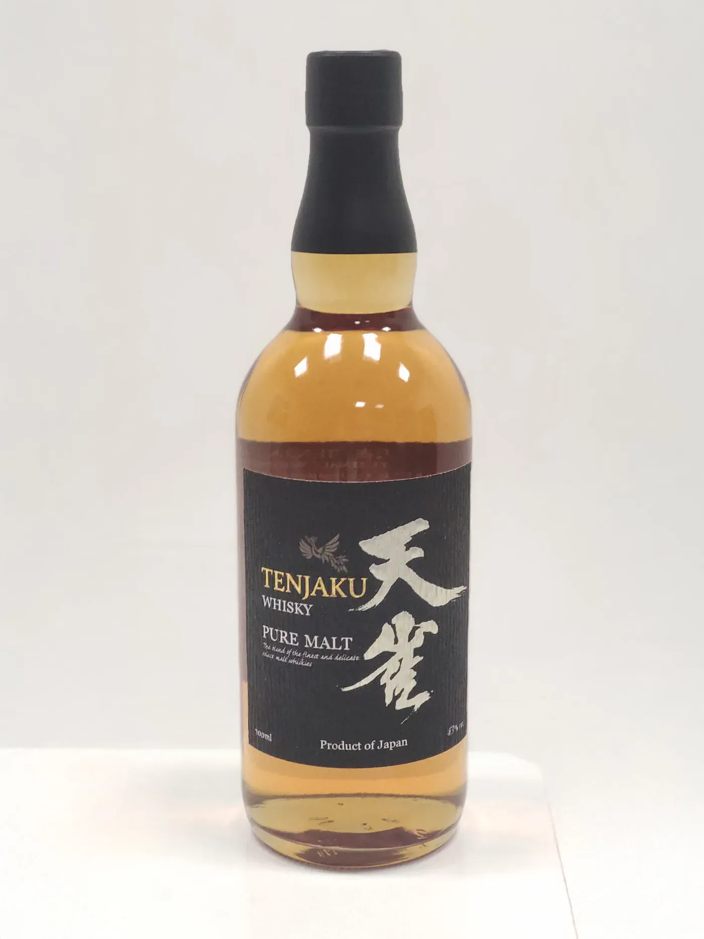 Original studio photo of a Tenjaku Pure Malt whisky bottle on a plain background